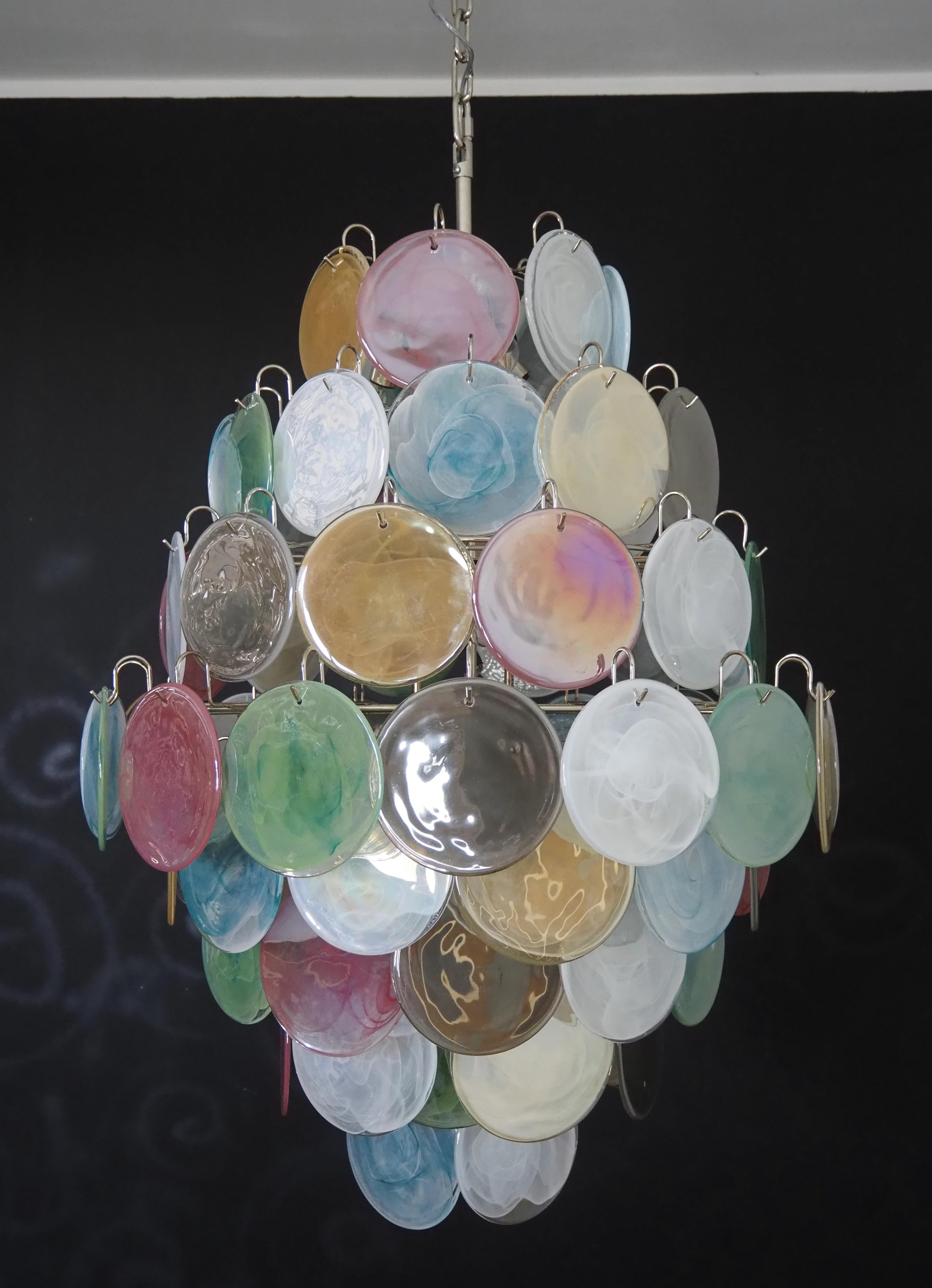 Vintage Italian Murano chandelier in Vistosi style. The chandelier has 87 fantastic multicolored alabaster iridescent glasses in a nickel metal frame.
Period: late 20th century
Dimensions: 67,80 inches (175 cm) height with chain; 40,70 inches (105