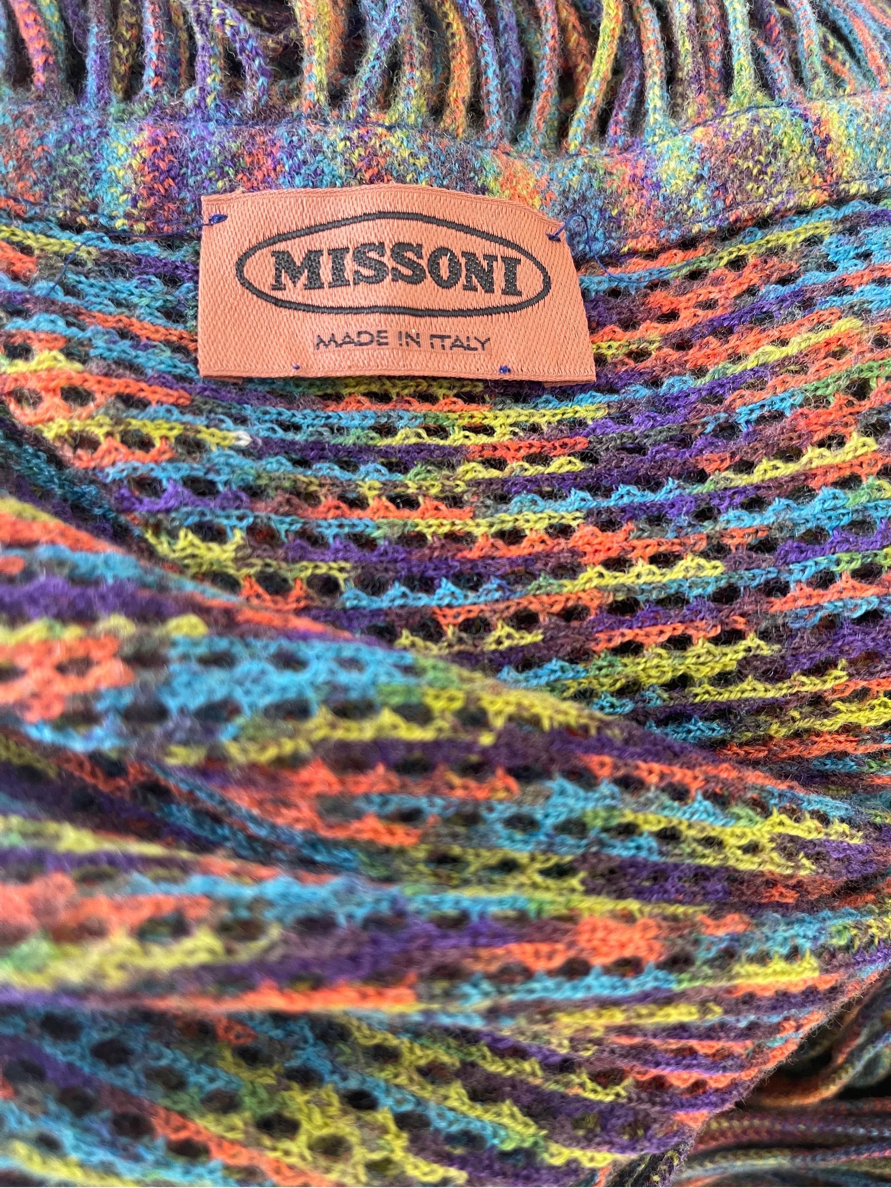 Gorgeous and rare late 1990s MISSONI colorful knit fringe cape wrap shawl ) ! This beauty measures an impressive 60 inches x 60 inches ( 5 feet x 5 feet ). Bright vibrant colors of purple, turquoise blue, orange, and green throughout. Crochet like