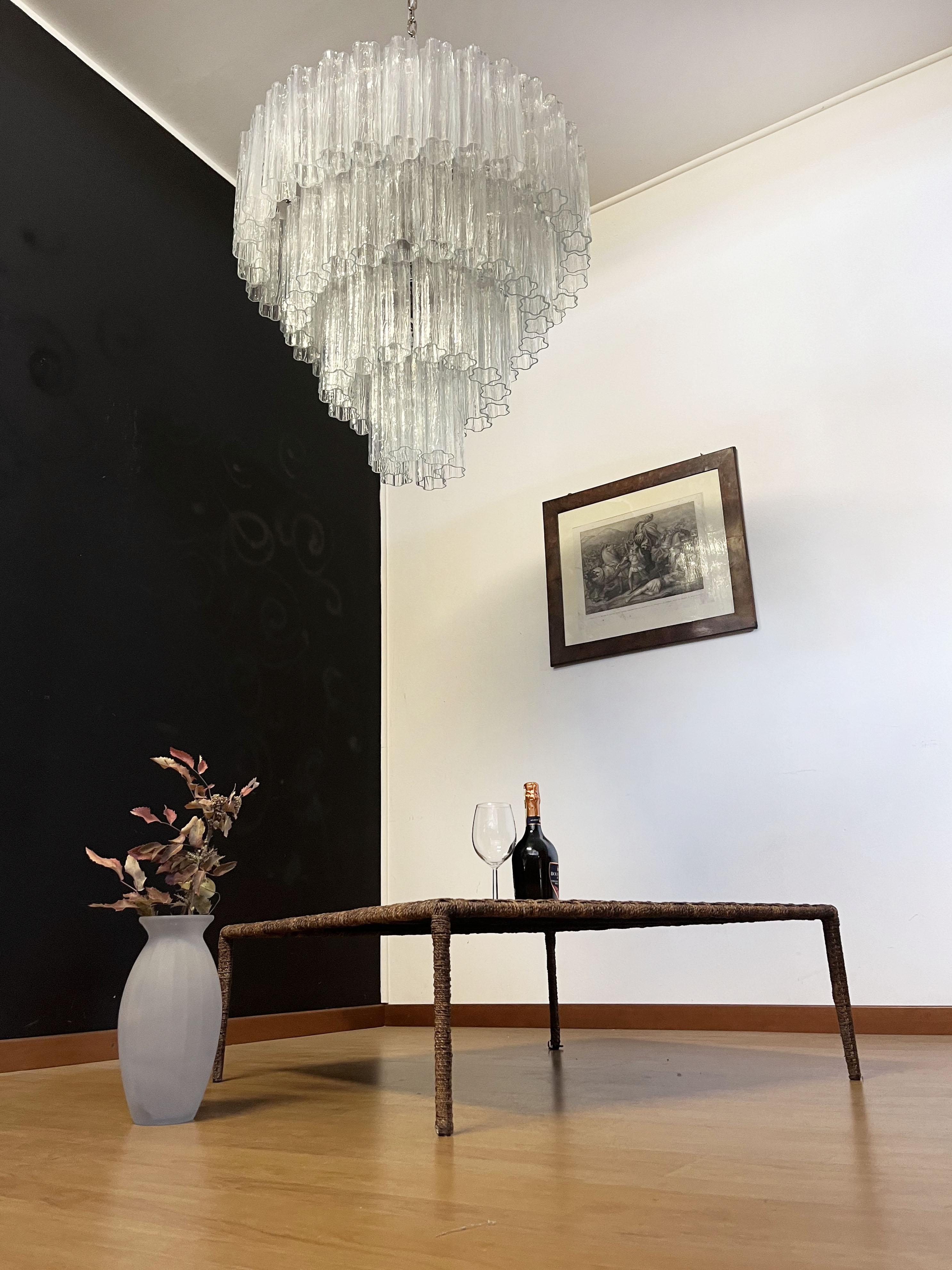 Italian vintage chandelier in Murano glass and nickel plated metal structure on 4 levels. The armor polished nickel supports 78 large amber glass tubes in a star shape.
Period:Late XX century
Dimensions:	63 inches (160 cm) height with chain; 35,45