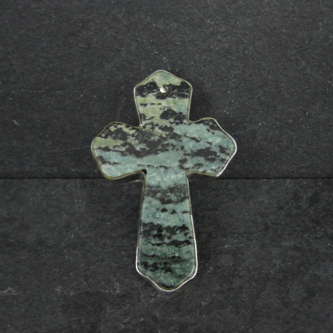 This huge, gorgeous ring is sterling silver with a turquoise cross.
At the time of purchase (secondhand) I was told the stone was from the Pixie turquoise mine but this has not been verified, mainly due to the fact that the mine did not produce a