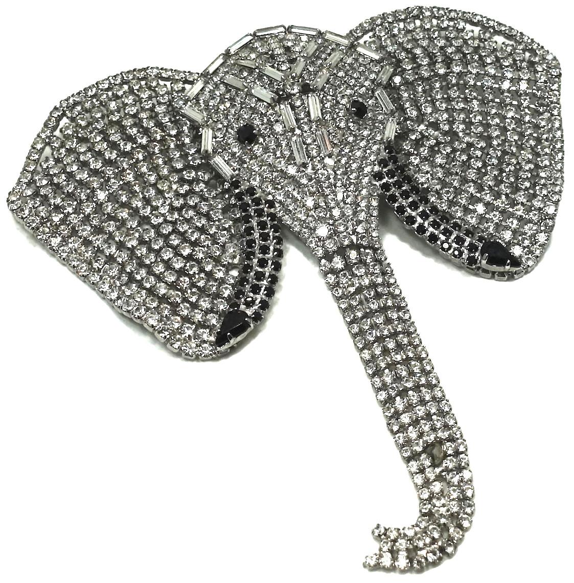 This vintage Butler & Wilton elephant brooch is famous.   The head, ears and trunk are completely covered with crystals. Its eyes have black crystals. In excellent condition, this brooch measures 4-1/2” x 4-3/4” and is signed “B&W” (Butler & Wilson).
