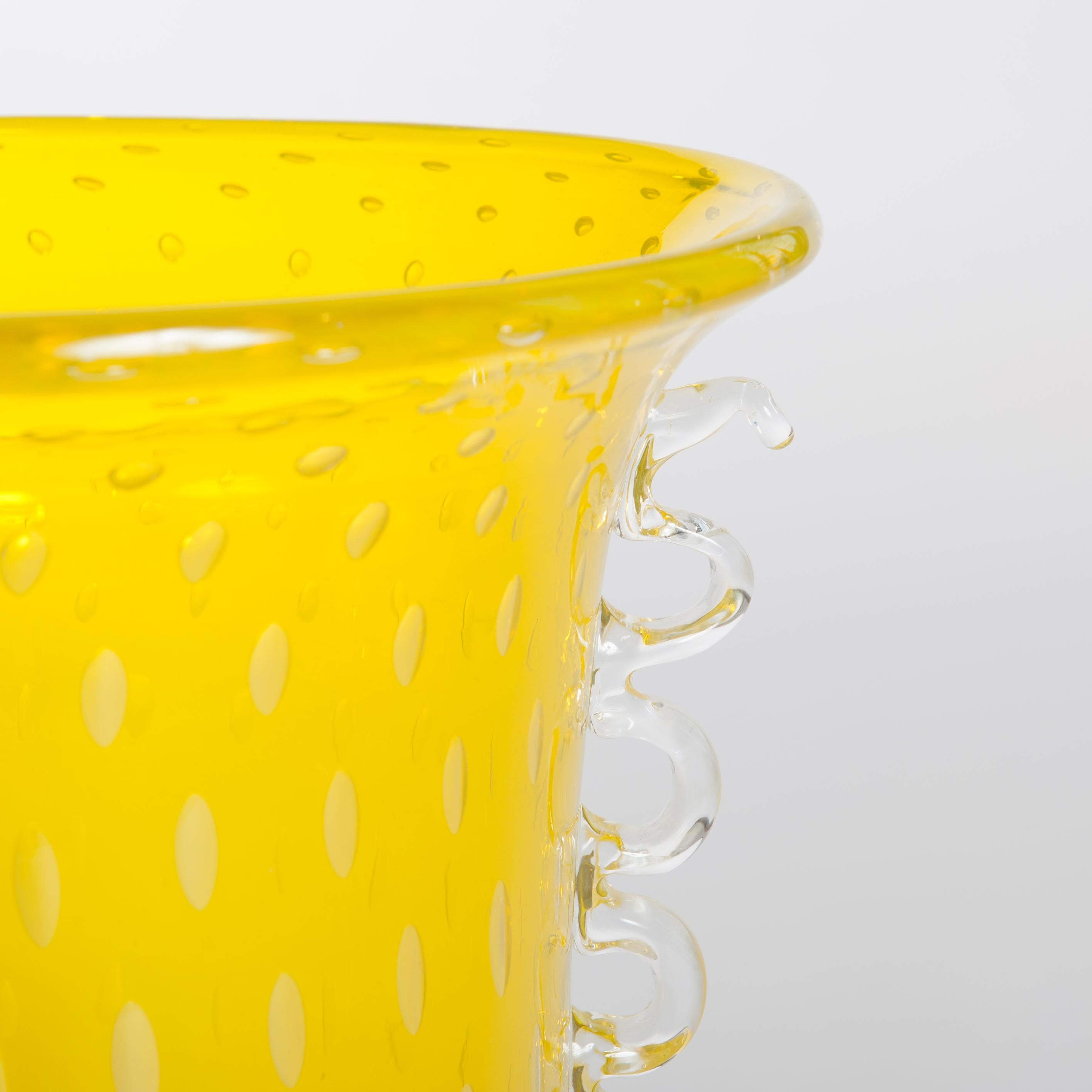 Amazing art glass vase in transparent-yellow color with transparent decorative handles.
The glass mass contains numerous bubbles - the technique is called 