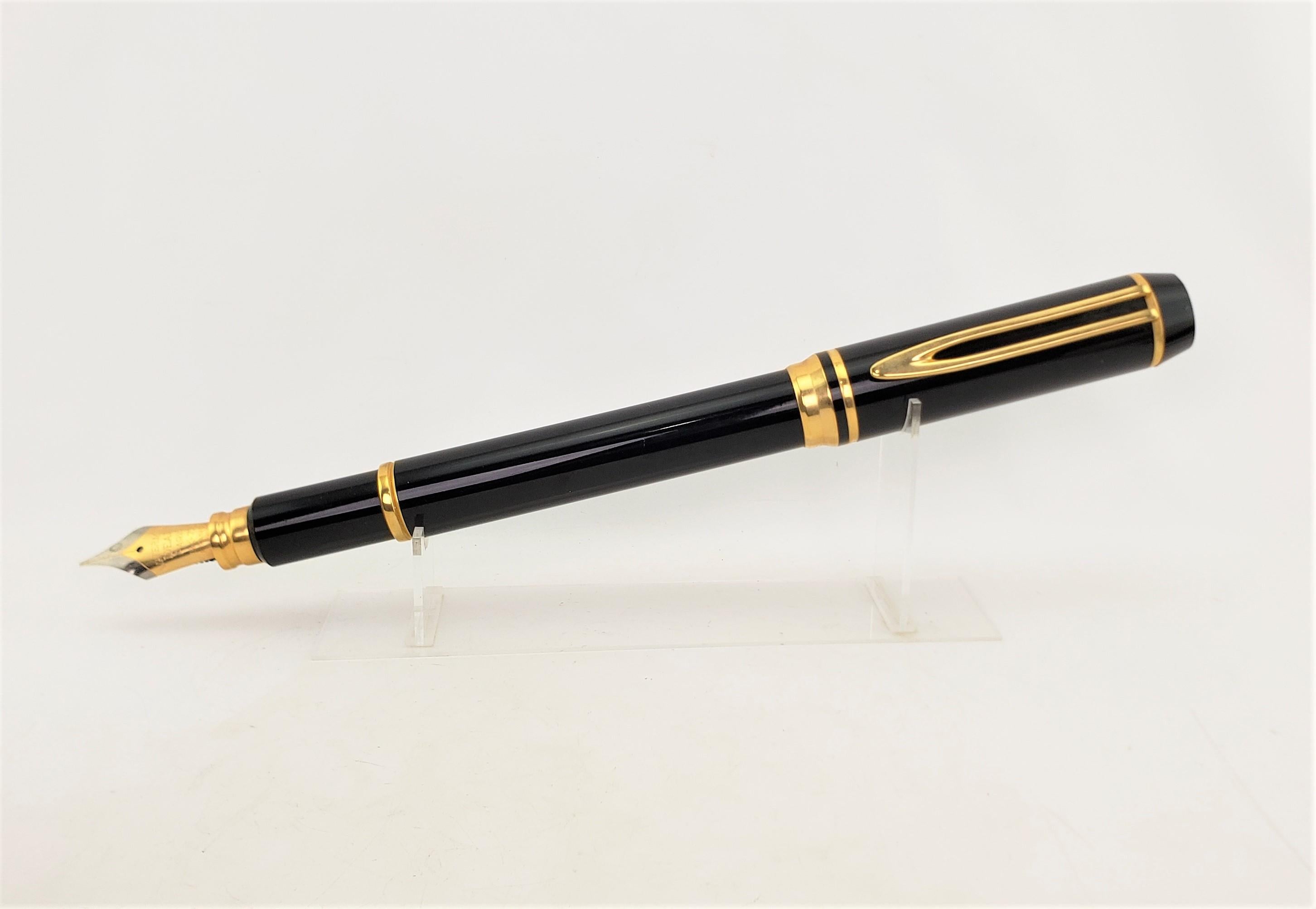 This enormous figural fountain pen store display is unsigned, but presumed to have been made by the Waterman Co. of France in approximately 1965 and done in the period Mid-Century Modern style. The display model is composed of a hard molded black