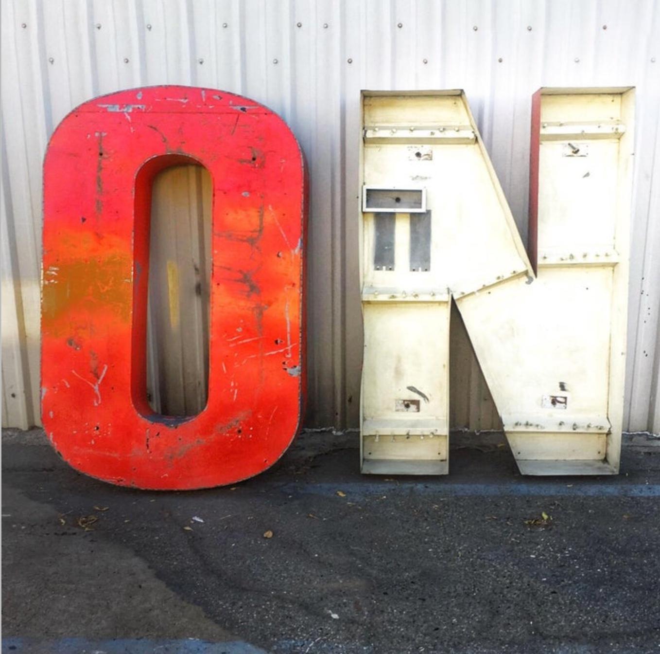 Huge weathered on industrial sign. Very cool.

Dimensions are per letter.