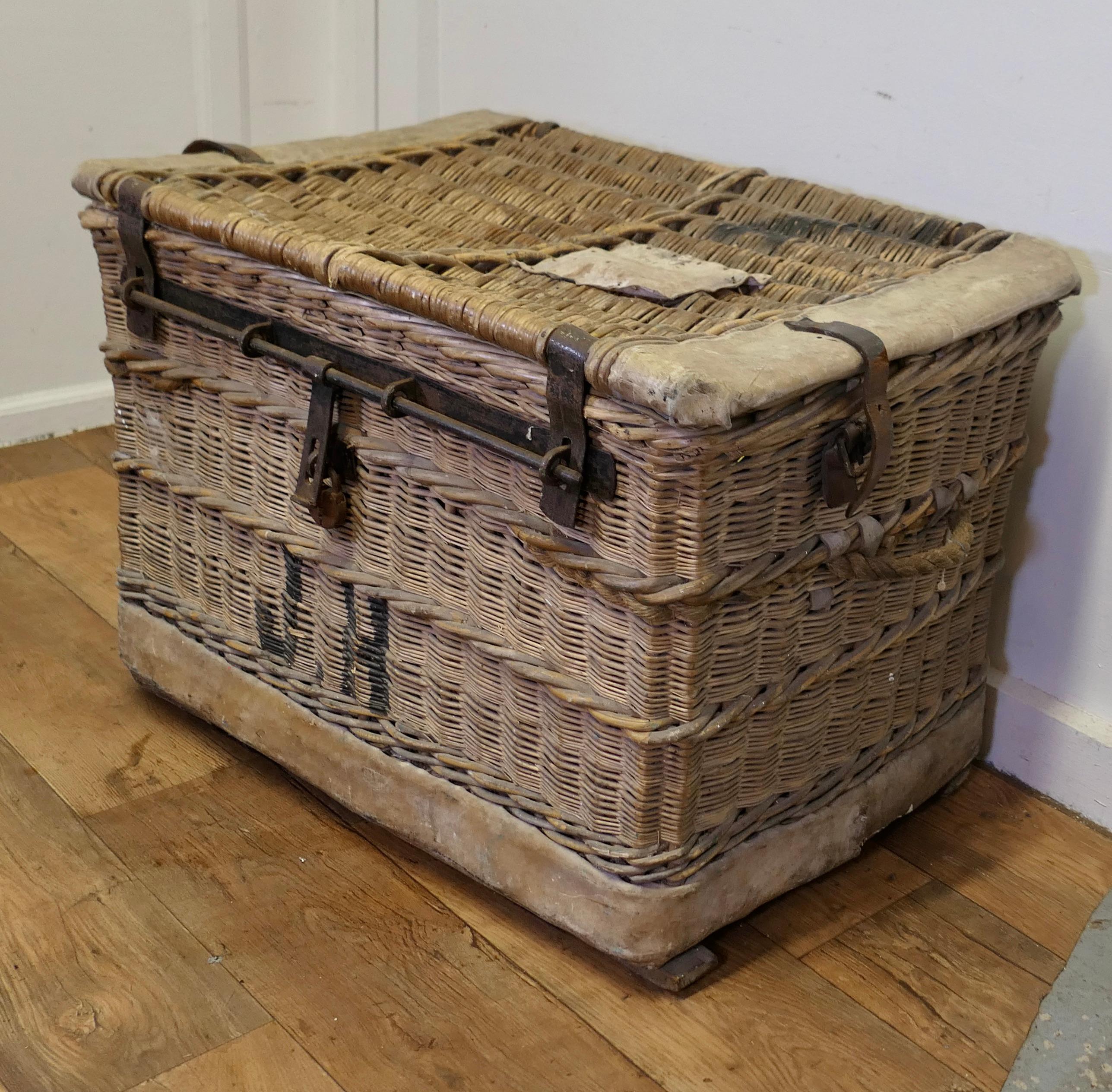 Huge Wicker Railway Parcel Hamper
Very strong and attractive piece, in good complete condition, with the original iron locking clasp, hide corners and rope carrying handles as the interior is lined in green felt it is safe to assume that the hamper