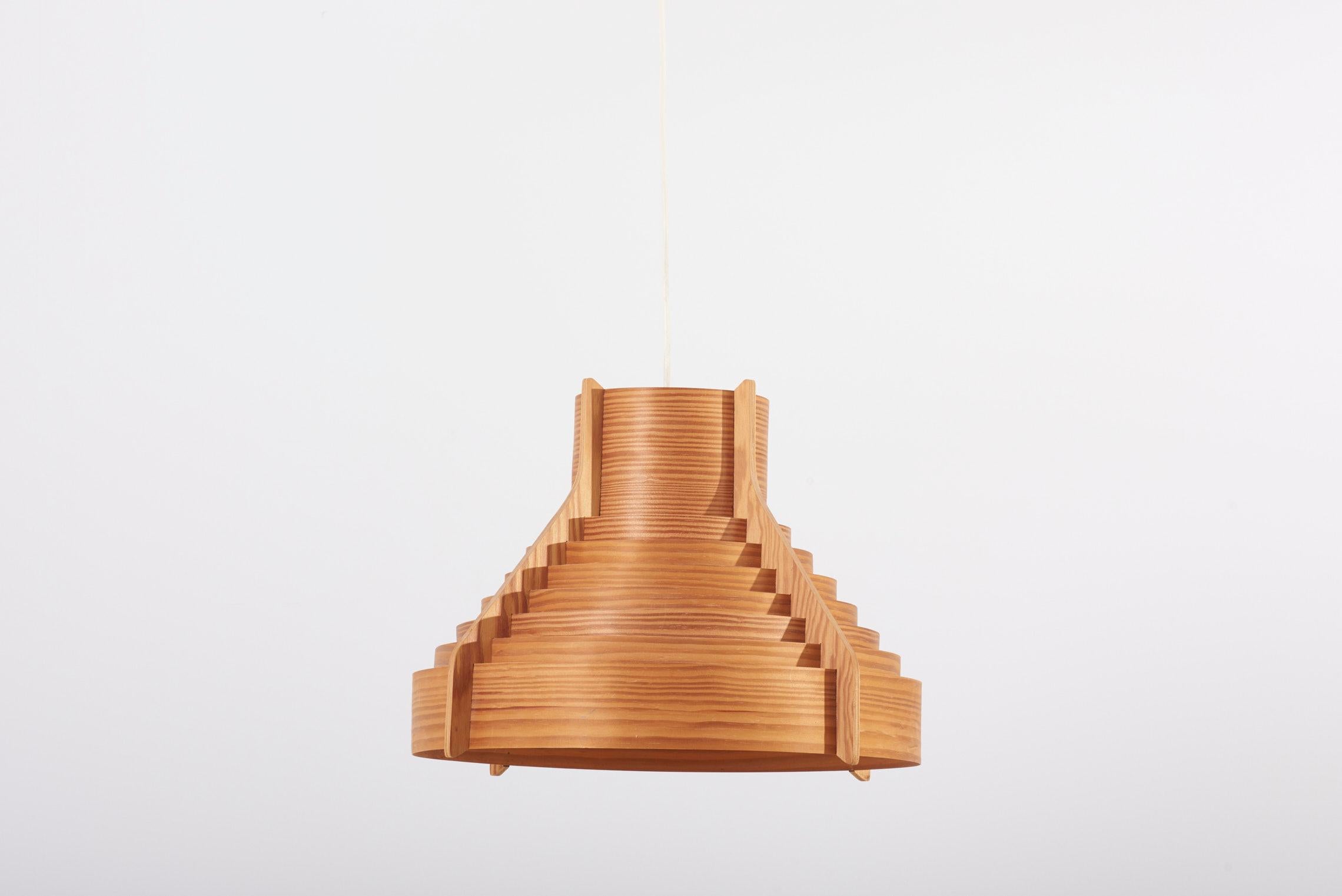 Huge Wooden pendant lamp, designed in 1960s by Hans-Agne Jakobsson and manufactured by AB Ellysett Markaryd in Sweden.

1 x E27 socket.

Please note: Lamp should be fitted professionally in accordance to local requirements.