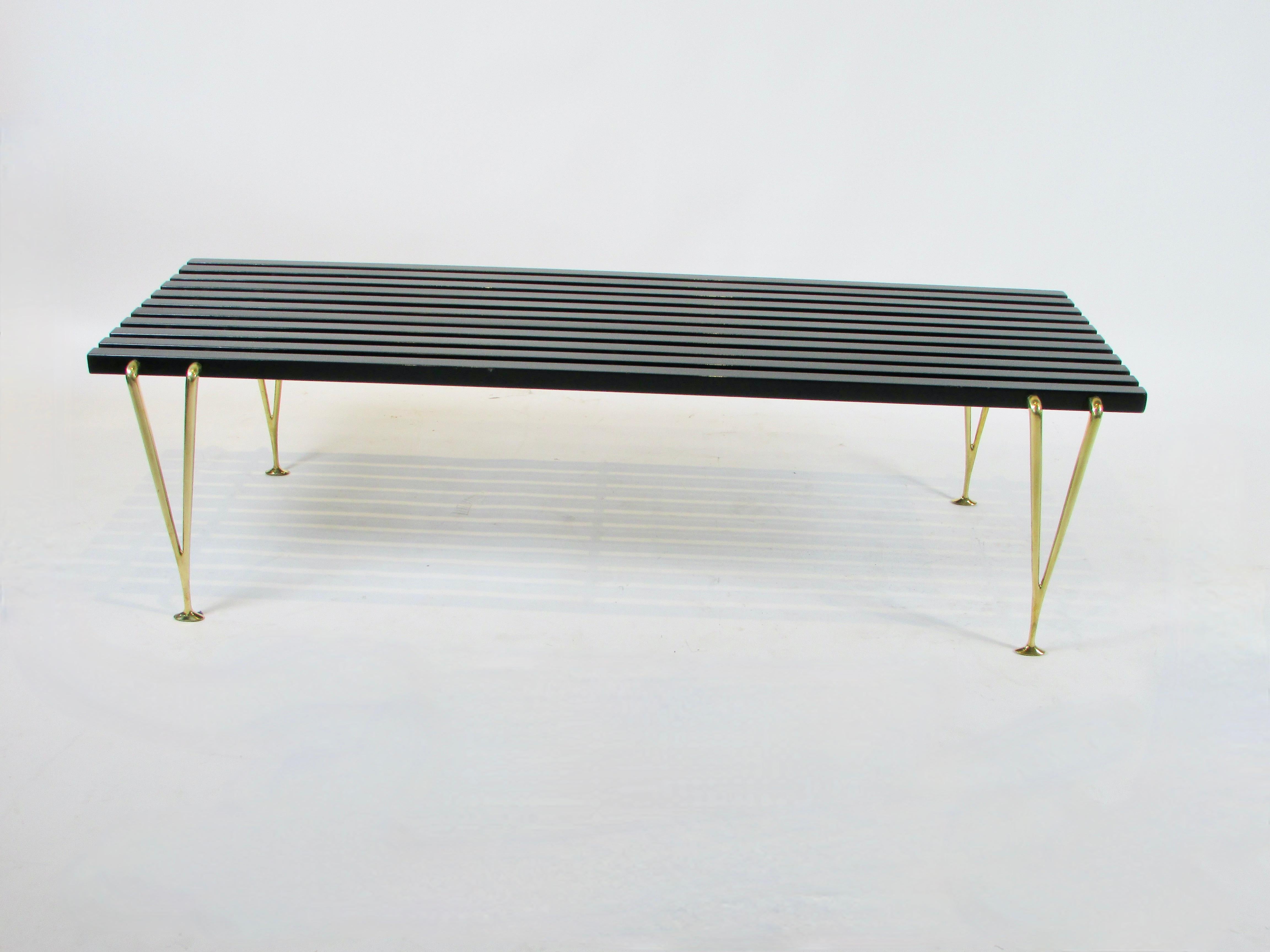 Polished Hugh Acton black slatted cocktail table or bench on brass legs  For Sale
