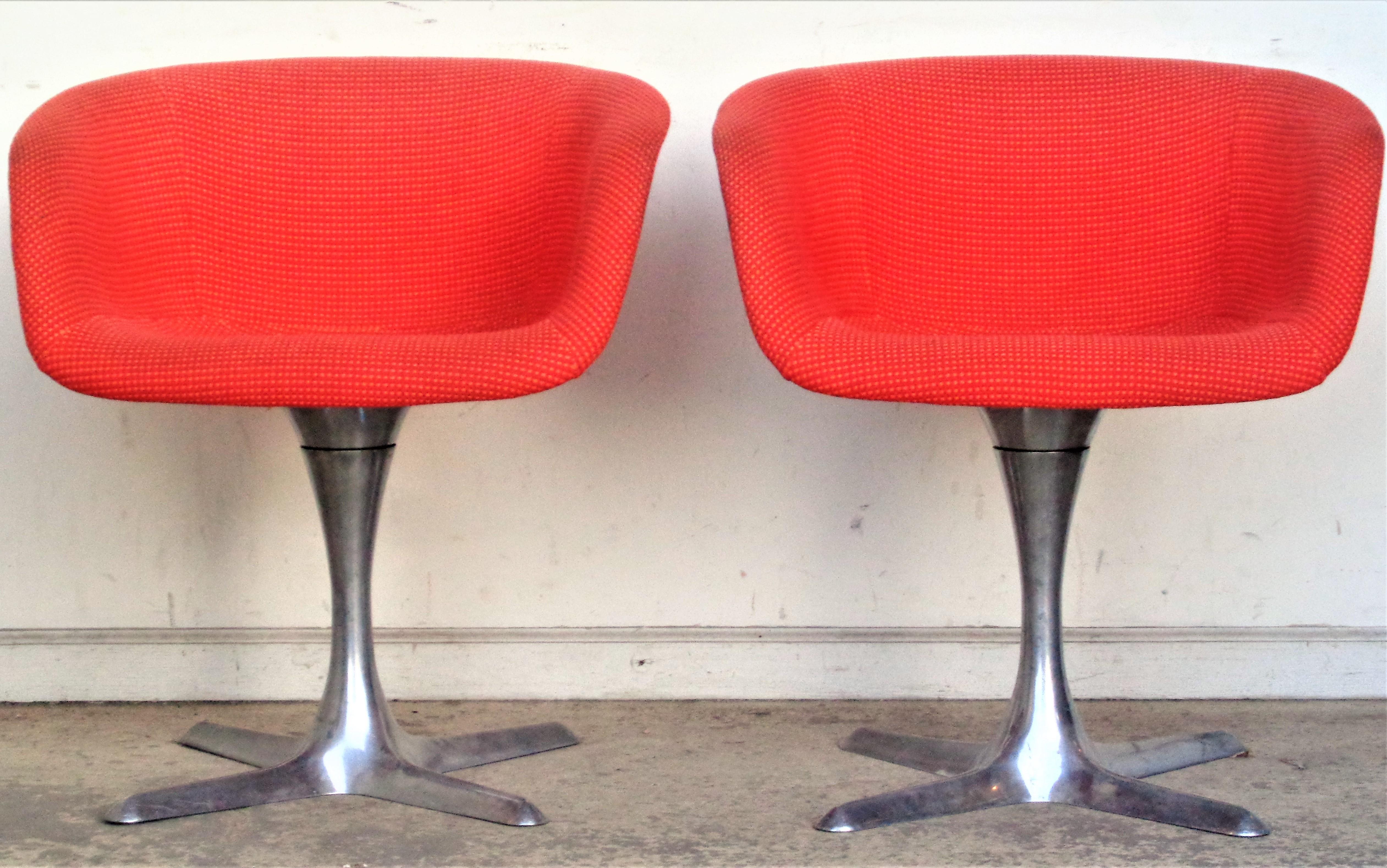 Pair of polished aluminum base swivel barrel chairs with a Knoll type contract grade two tone woven wool tweed upholstery. Designed by Hugh Acton for Burke-Acton ( see label on underside ) in all original vintage condition. A hard to find pair of