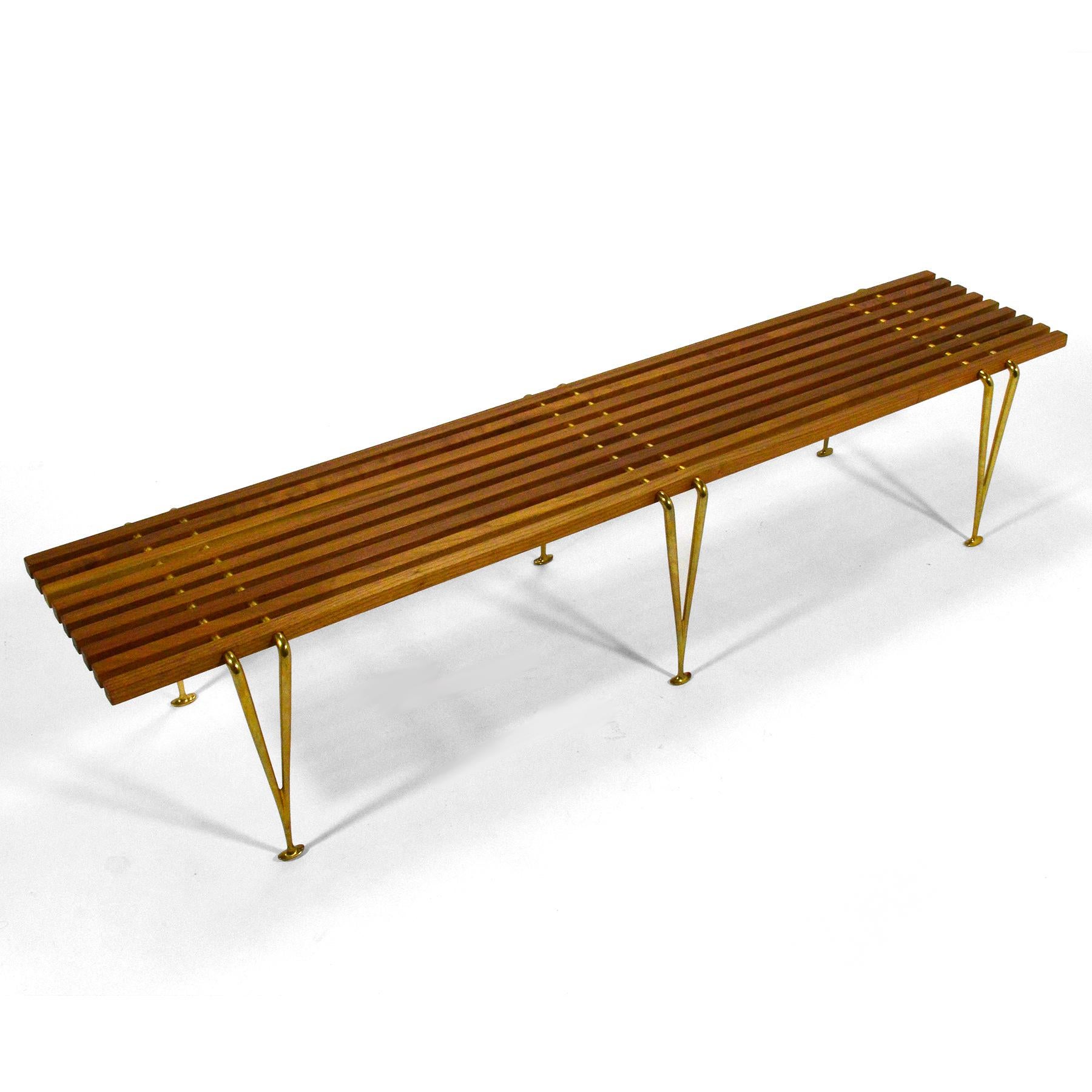A beautiful example of an important design by artist, engineer, and designer Hugh Acton. Designed in 1954, the suspension beam bench features cherrywood slats connected to elegant cast brass legs. This example is hand signed.