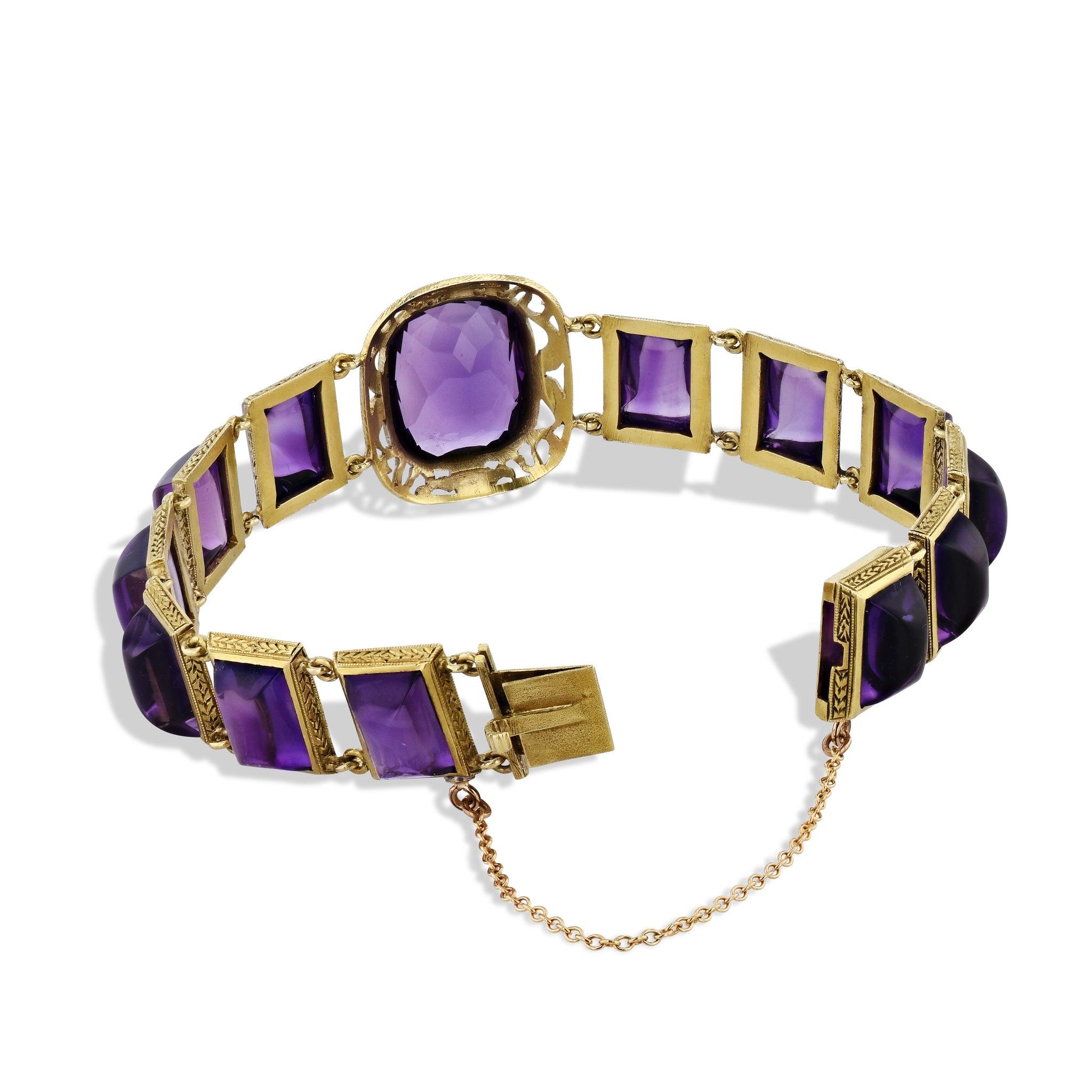 The Hugh Connolly & Son Amethyst Yellow Gold Estate Bracelet is an exquisite piece of timeless beauty and luxury. This 14kt. Yellow Gold bracelet features a stunning antique cushion cut natural Amethyst center, surrounded by 12 dazzling Sugar Loaf