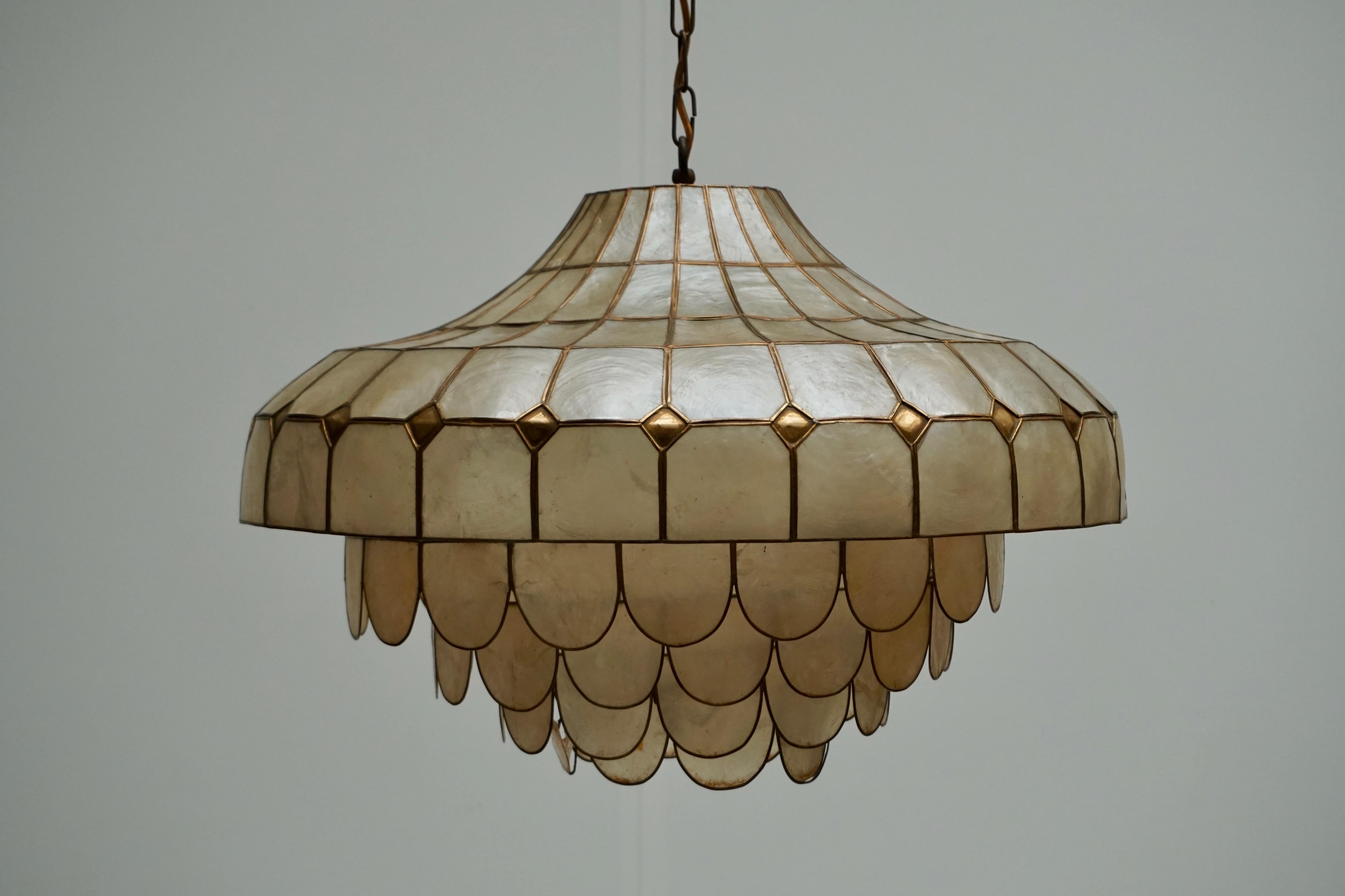 Gorgeous pendant lamp with countless Cadiz shell or nacre pieces and brass details forming a hugh magic hat. 
Stunning piece, checked and cleaned.