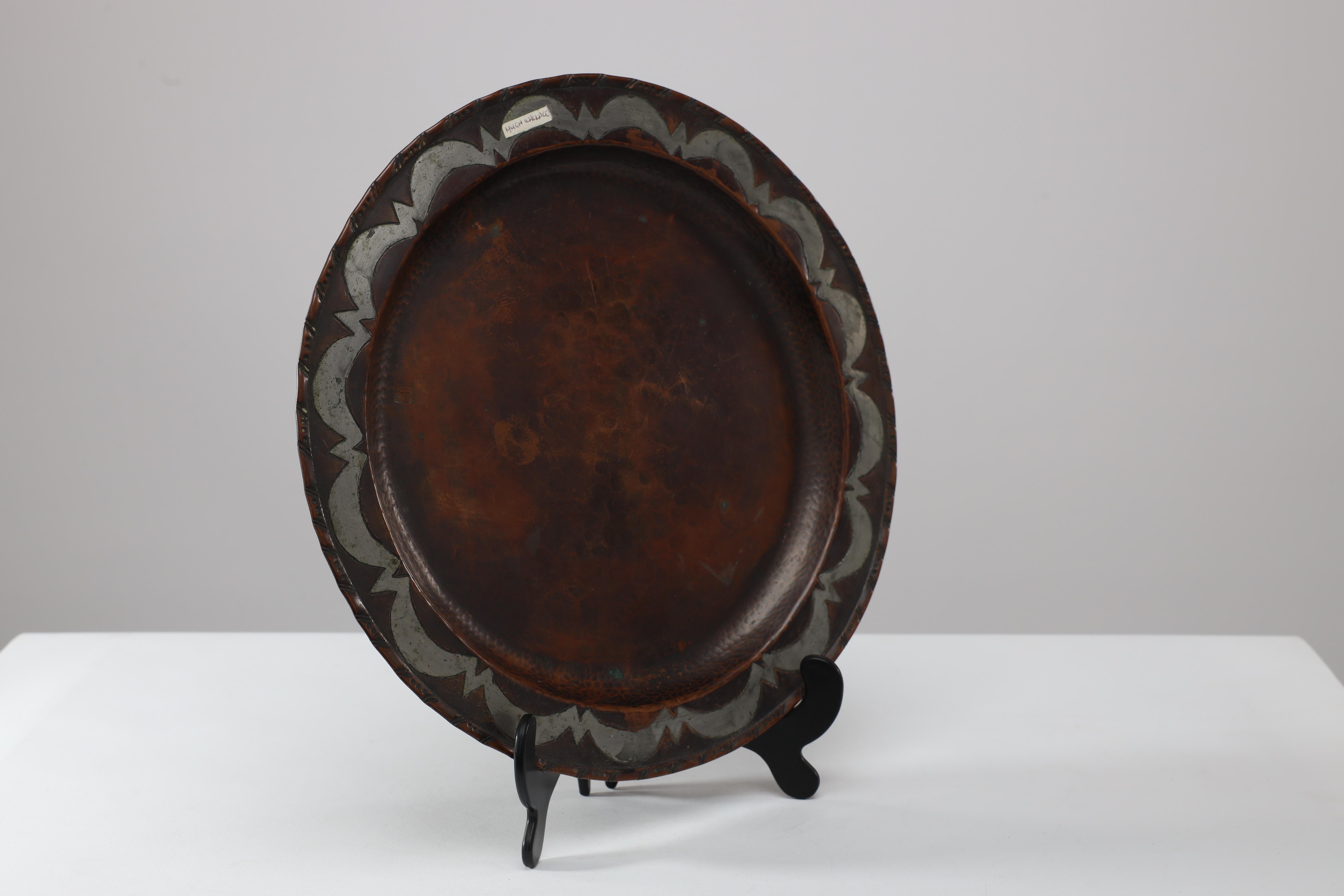 Arts and Crafts Hugh Wallis. An Arts & Crafts hand formed round copper plate For Sale