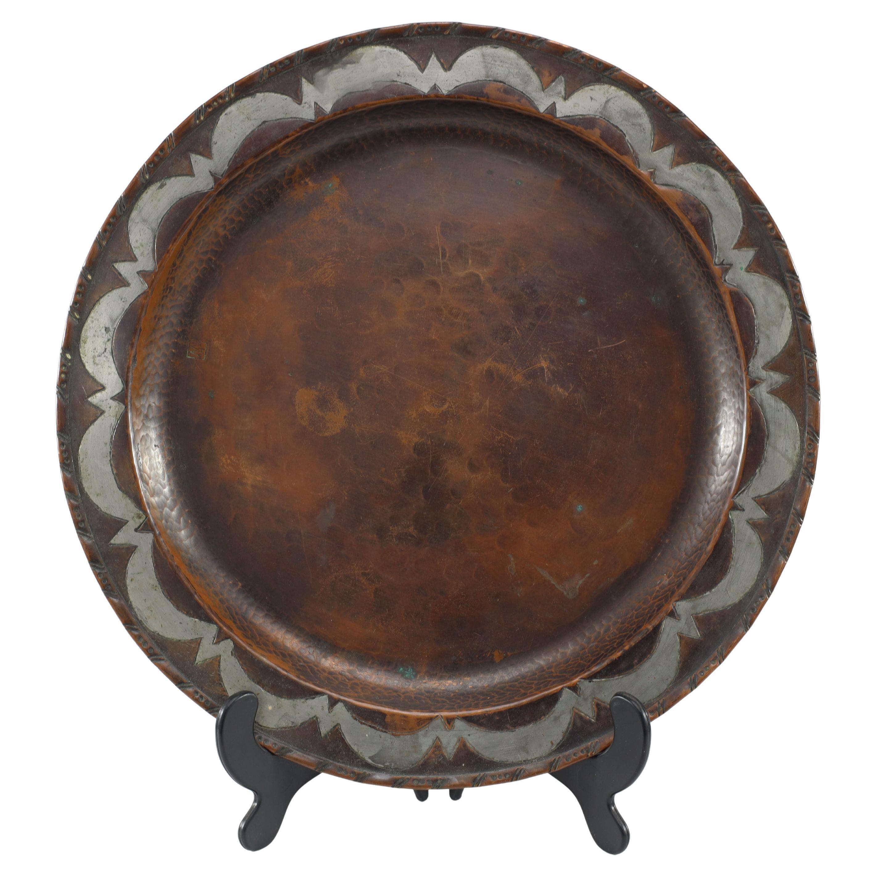 Hugh Wallis. An Arts & Crafts hand formed round copper plate For Sale