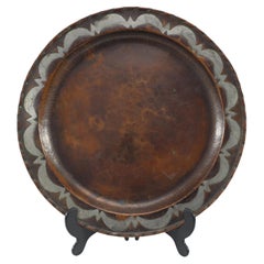 Hugh Wallis. An Arts & Crafts hand formed round copper plate
