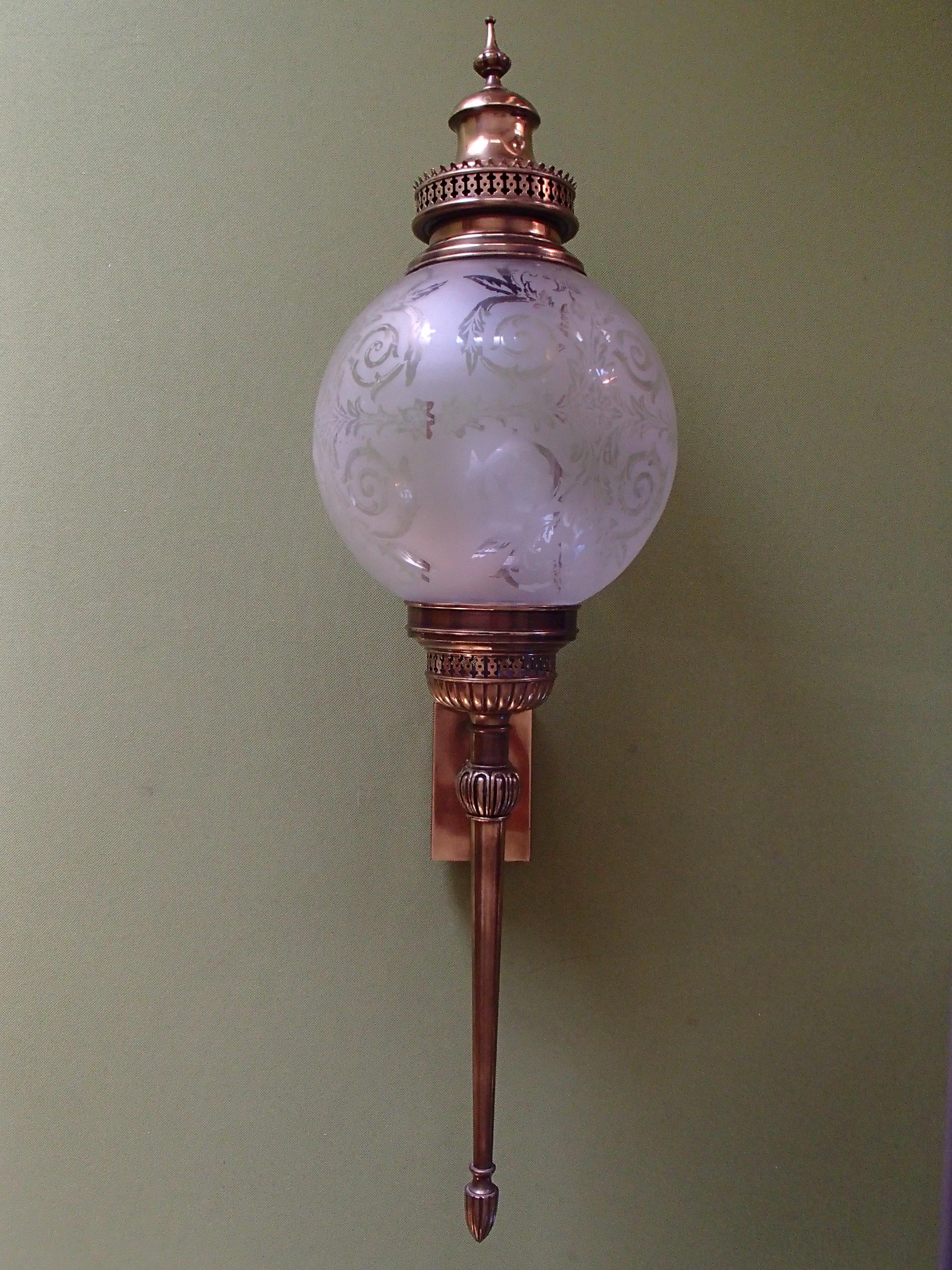 Hughe wall lights scones torches with round engraved glass and brass.