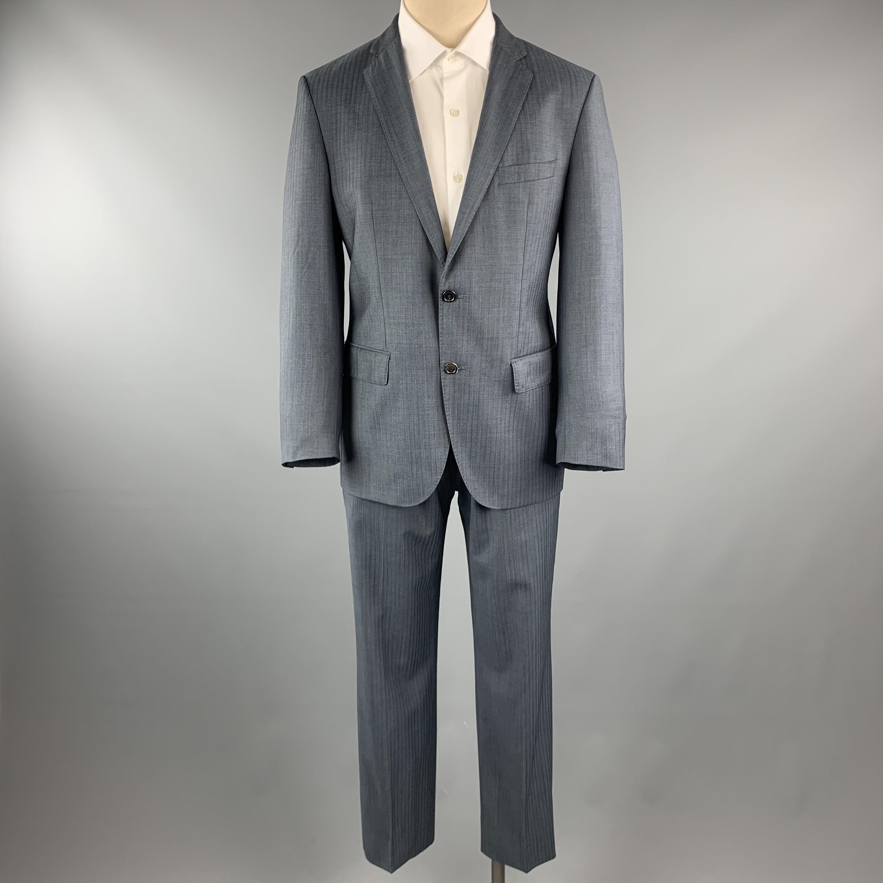 HUGO BOSS
suit comes in a blue stripe lana wool and includes a single breasted, two button sport coat with a notch lapel and matching front trousers.
Excellent Pre-Owned Condition. 

Marked:   38 

Measurements: 
  -JacketShoulder: 16.5 inches