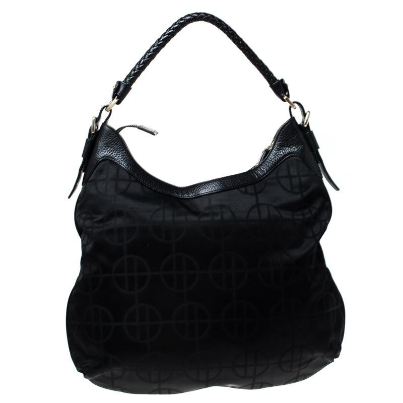 This Hugo Boss hobo is built for everyday use. Crafted from black nylon and leather, it has a single handle for you to parade it. The canvas insides are spacious and the hobo is complete with a pocket on the front.

Includes: Original Dustbag

