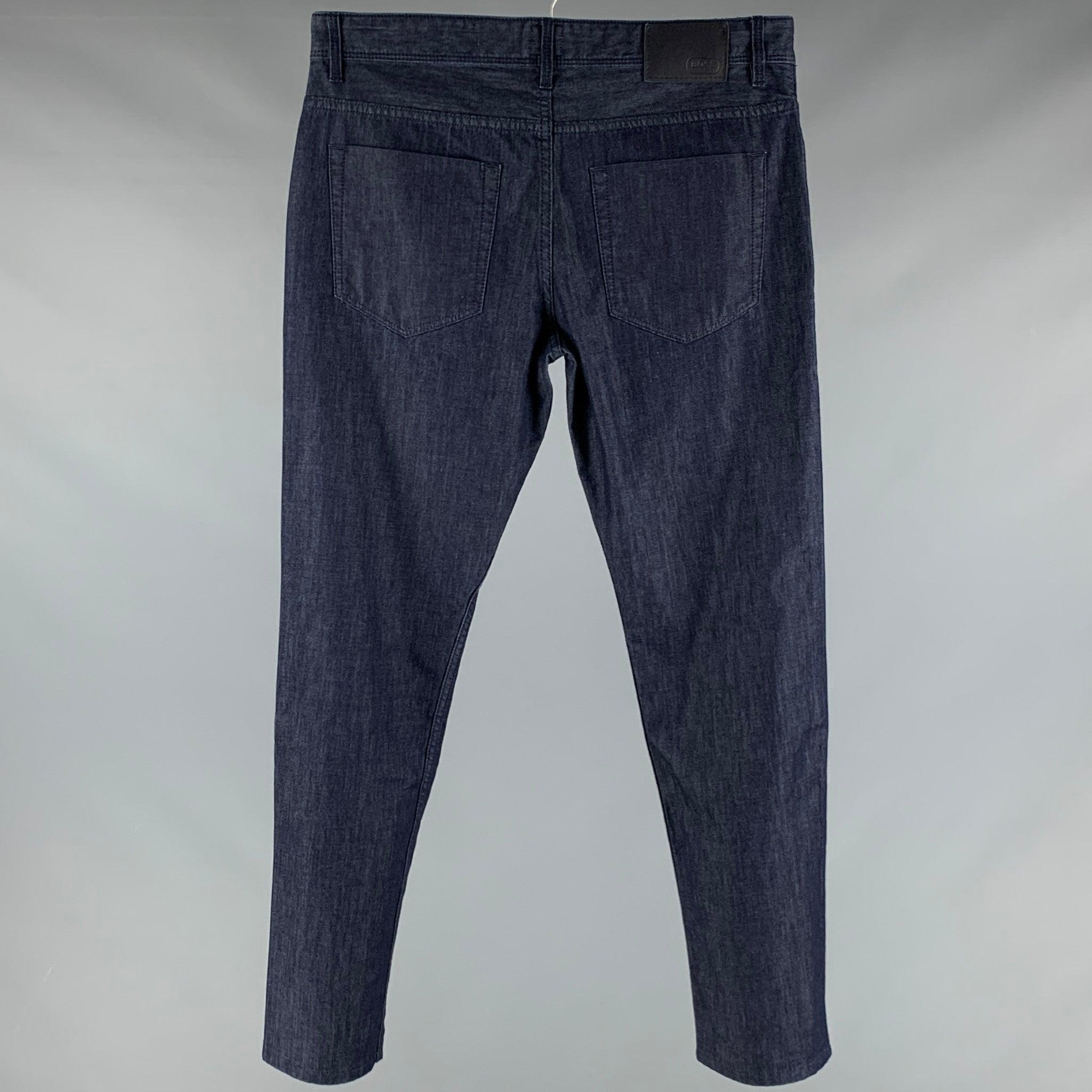 BOSS by HUGO BOSS jeans
in a blue cotton blend fabric featuring five pockets style, and zip fly closure.Excellent Pre-Owned Condition. 

Marked:   33/32 

Measurements: 
  Waist: 32 inches Rise: 8.5 inches Inseam: 32 inches 
  
  
 
Reference: