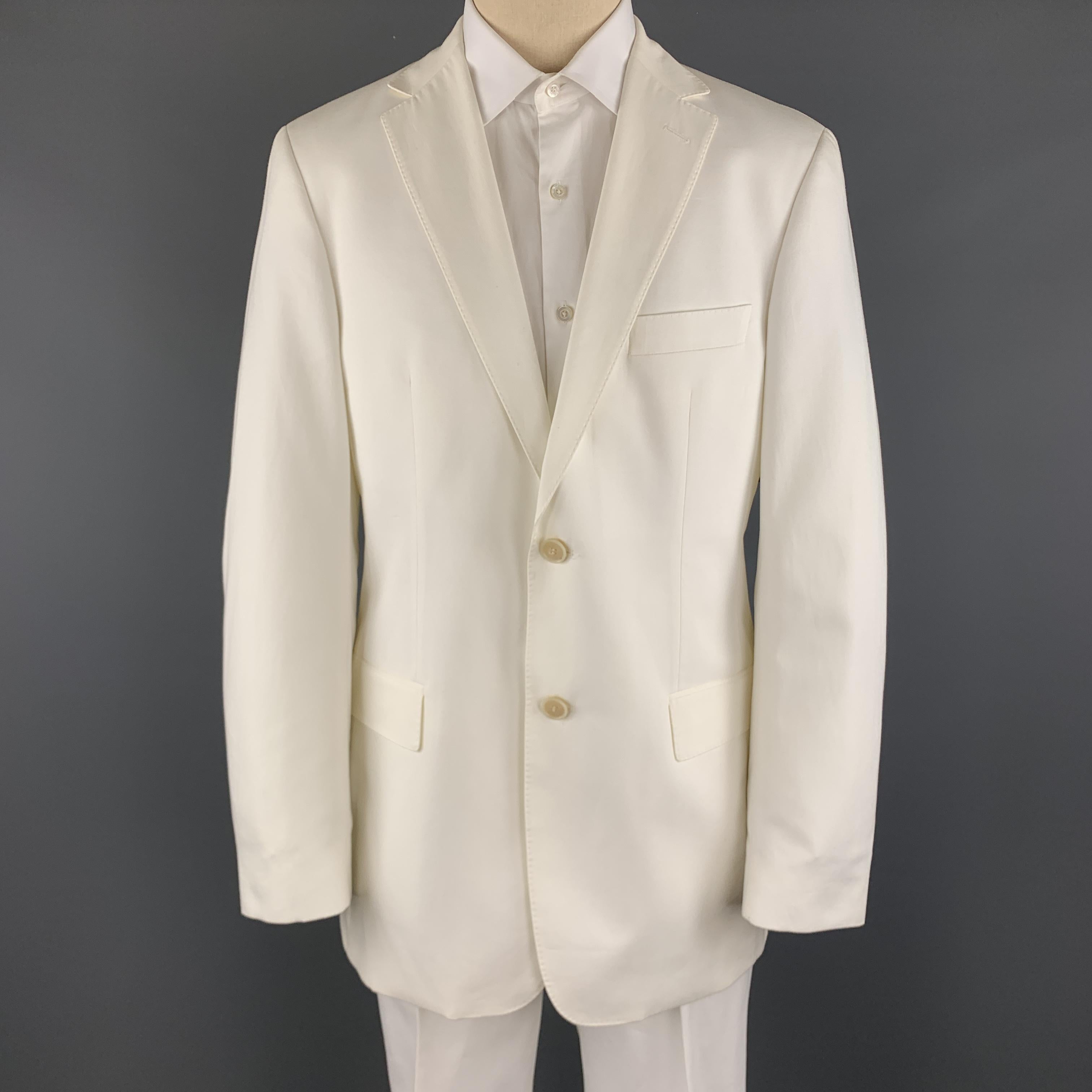 HUGO BOSS suit comes in white cotton and includes a single breasted, two  button sport coat with a notch lapel and matching flat front trousers. Minor wear on jacket and pants are unhemmed, never worn. As-is. Made in USA. 

Good Pre-Owned