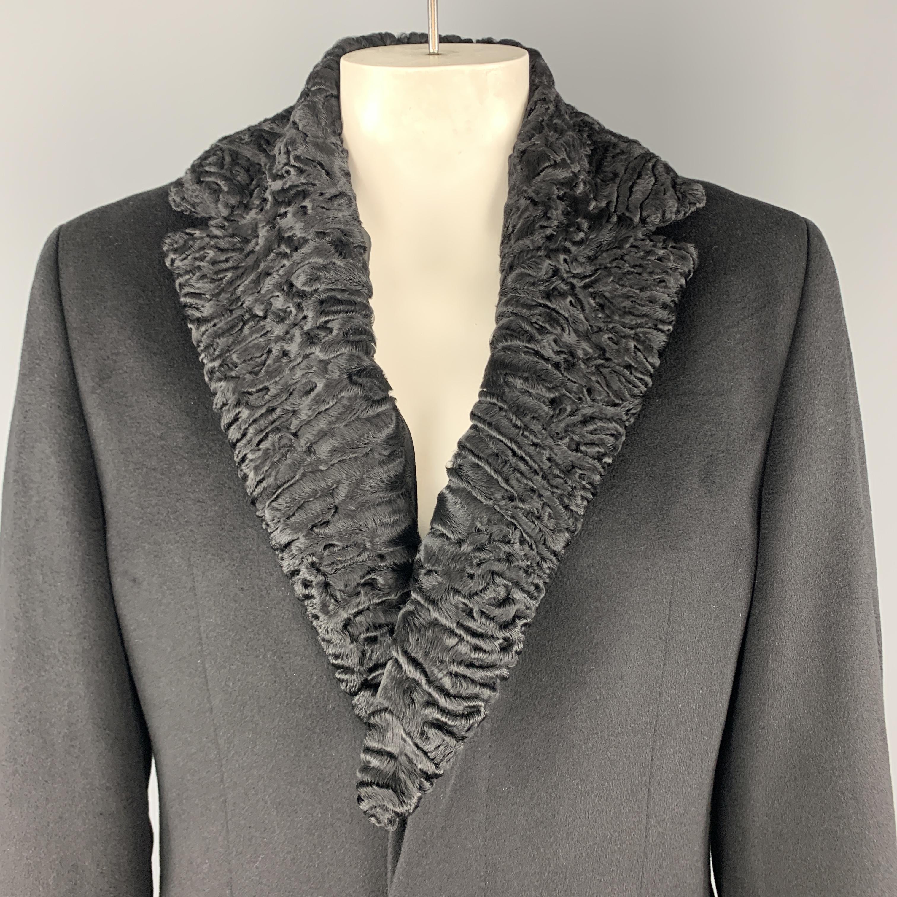 HUGO BOSS coat comes in black wool blend with a hidden placket button front, and notch lapel, with detachable fur collar. 

Excellent Pre-Owned Condition.
Marked: 42

Measurements:

Shoulder: 19 in.
Chest: 46 in.
Sleeve: 26 in.
Length: 41 in.