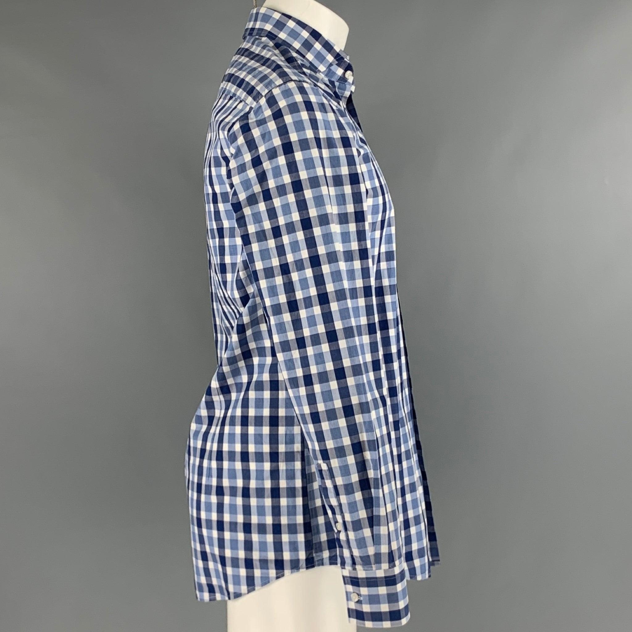 HUGO BOSS long sleeve shirt
in a
blue and white cotton fabric featuring plaid pattern, slim fit, and button closure.Very Good Pre-Owned Condition. Minor pilling. 

Marked:   15.5 

Measurements: 
 
Shoulder: 17 inches Chest: 38 inches Sleeve: 26