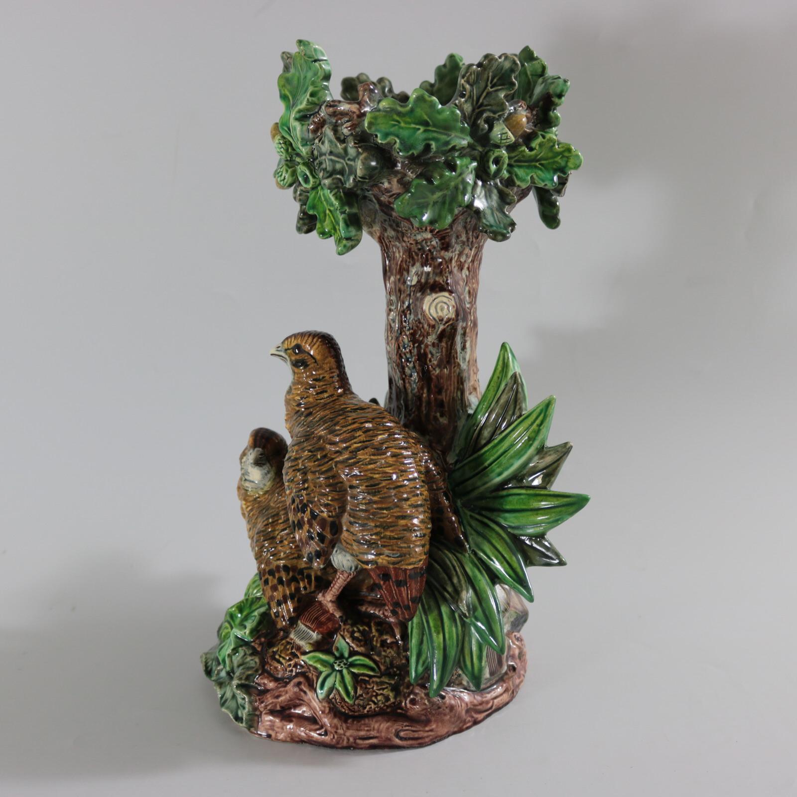 Lonitz Majolica cache pot stand which features partridges in front of reeds and an oak tree. Colouration: green, grey, brown, are predominant. The piece bears maker's marks for the Lonitz pottery. Bears a pattern number, '1204'.