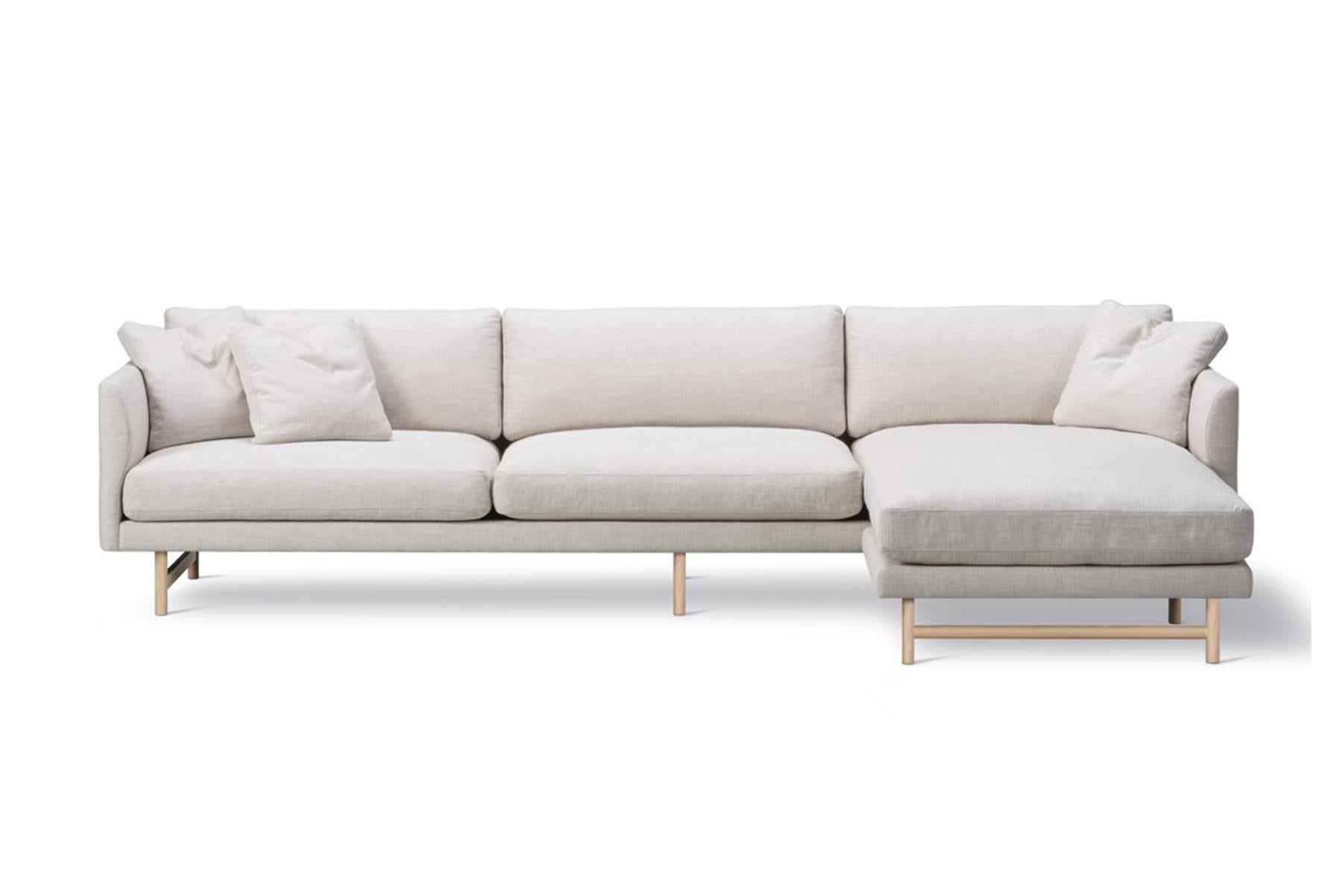 Hugo Passos Calmo sofa 95 – 3-seater – chaise – wood base the look is simple and serene in this expansive 3-seater Calmo sofa, where straight lines converge with discrete curved details. Comfy cushions complete the picture in this understated