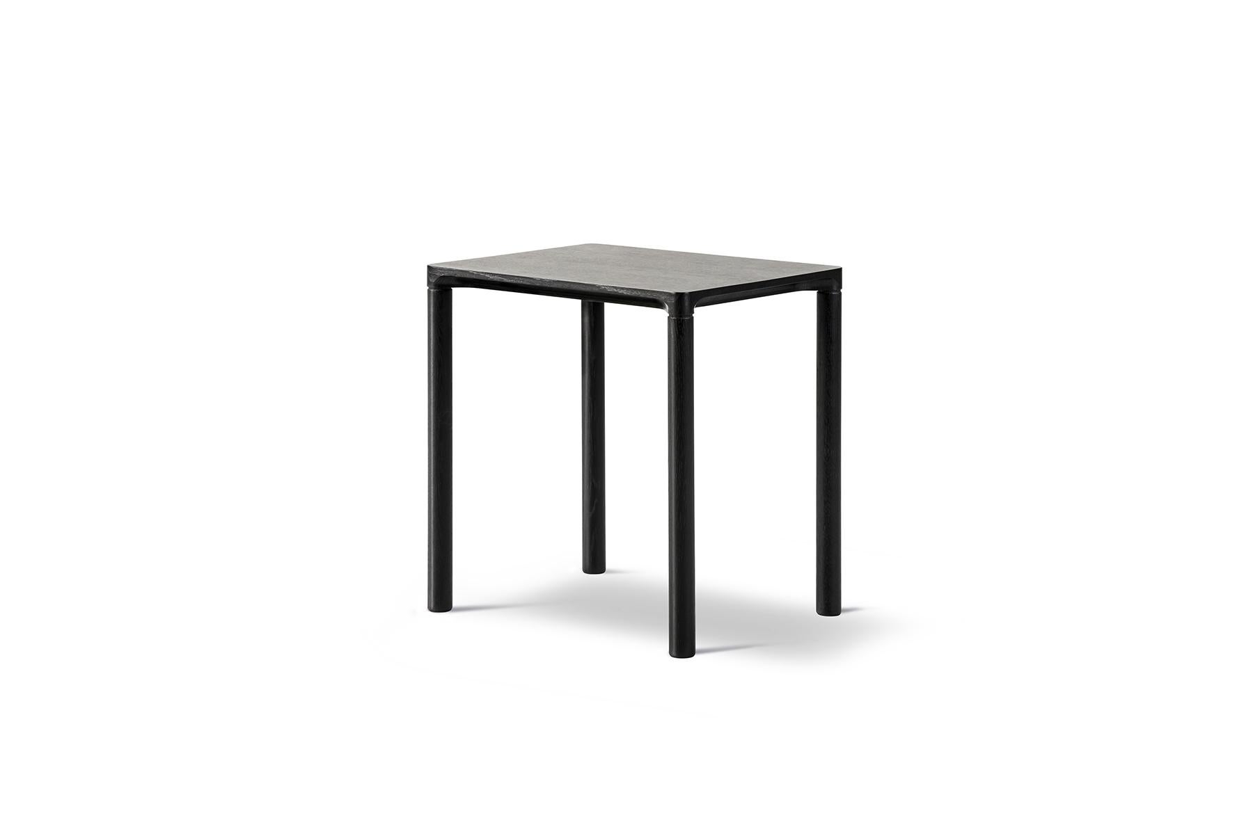 Hugo Passos Piloti table – Small is a series of solid oak side tables. The subtle detailing of the table top creates the impression of a single line, floating between four delicate legs. The tables are supplied in two heights and can be combined as