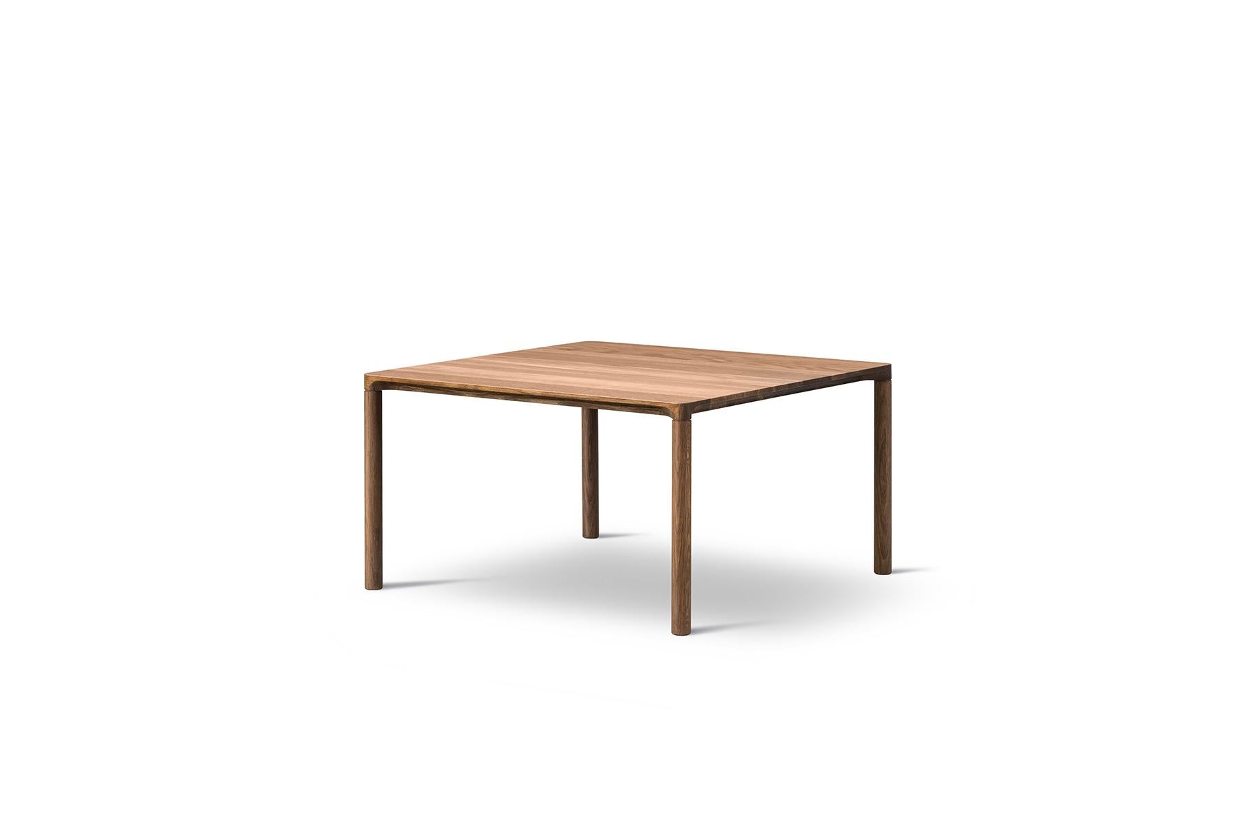 Hugo Passos Piloti table – Square is a series of solid oak side tables. The subtle detailing of the table top creates the impression of a single line, floating between four delicate legs. The tables are supplied in two heights and can be combined as