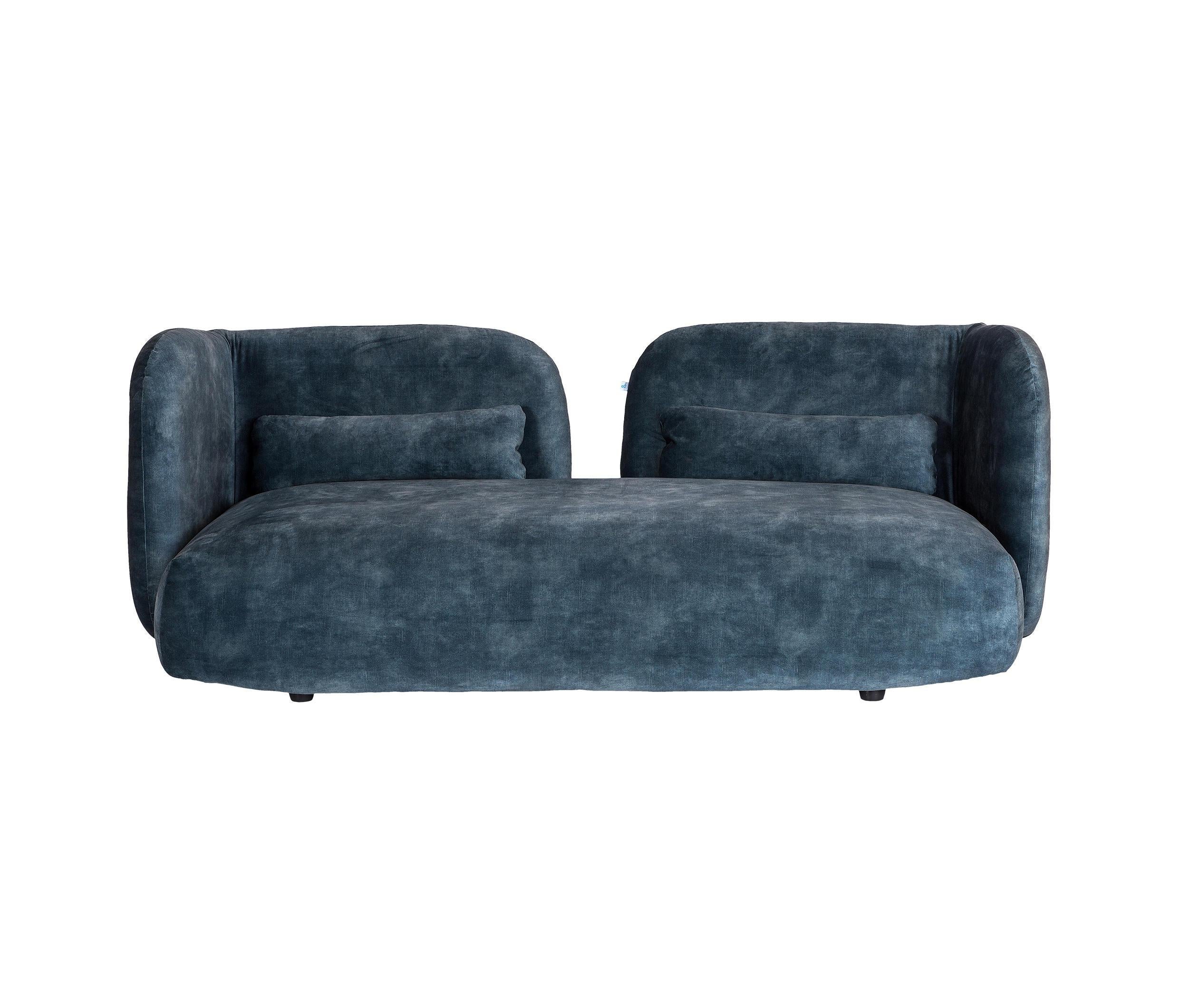Crafted in luxurious velvet, this charming two-seater upholstered sofa features a distinctive design characterized by two plush, contoured backrest cushions, offering an inviting and exceptionally comfortable seating experience with a captivating