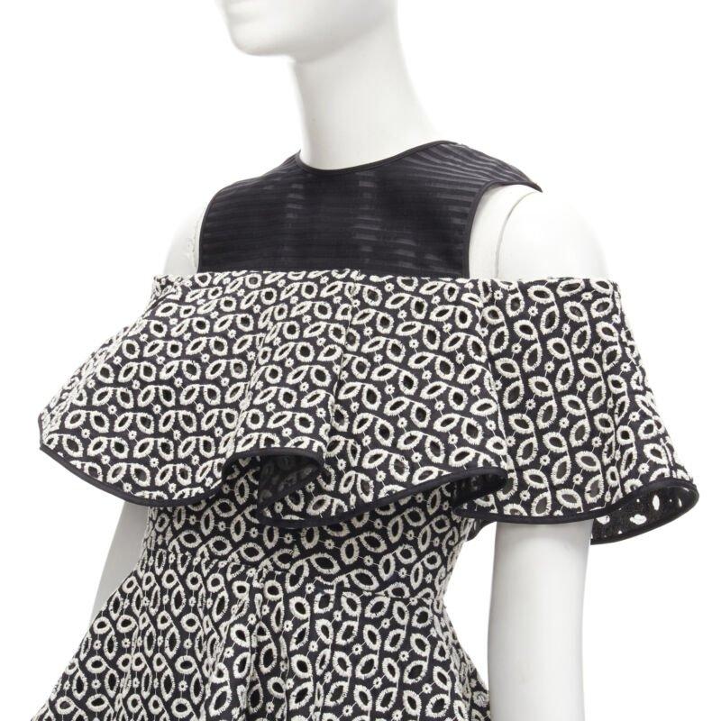 HUISHAN ZHANG black white eyelet embroidery anglais cold shoulder dress US2 XS
Reference: AAWC/A00176
Brand: Huishan Zhang
Material: Polyester, Silk, Cotton
Color: Black, White
Pattern: Abstract
Closure: Zip
Lining:  Fabric
Made in: