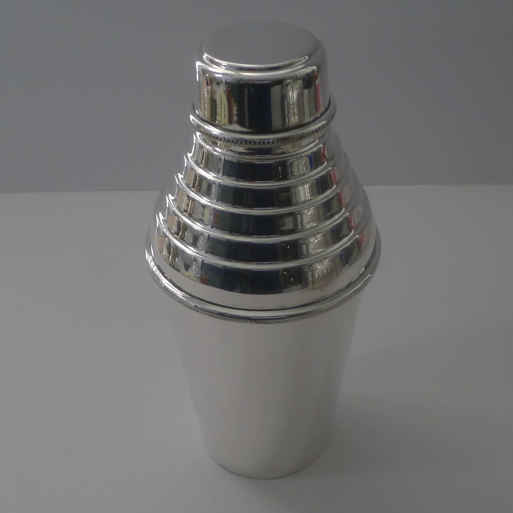 A stunning and stylish cocktail shaker by the highly sought-after and collectable silversmiths, Hukin & Heath, fully marked on the underside.

Just back from our silversmiths workshop where it has been professionally cleaned and polished, restoring