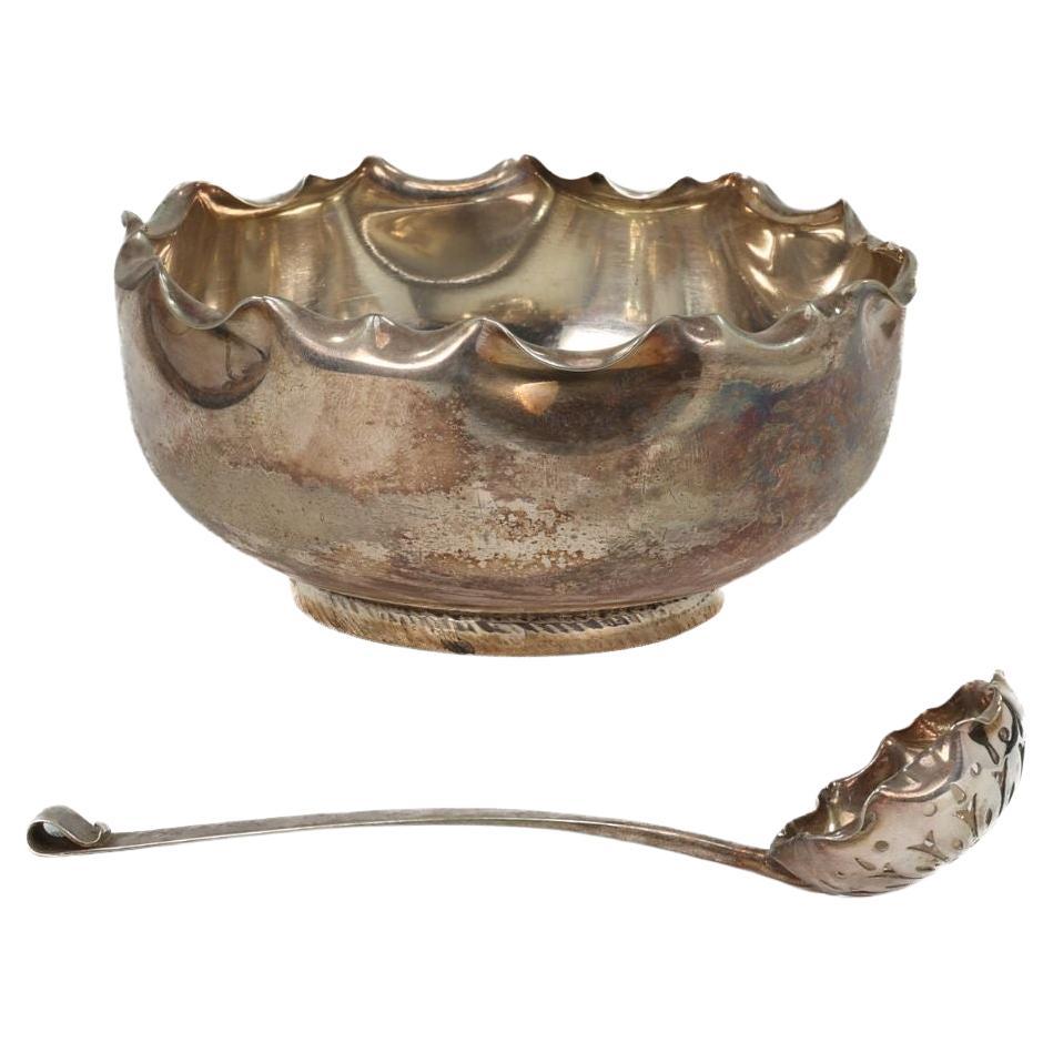 Hukin & Heath, Dresser style, A silver-plated sugar bowl & matching sugar spoon
