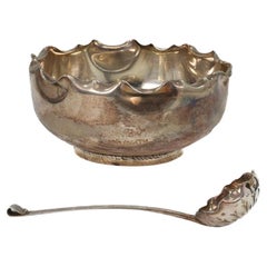 Hukin & Heath, Dresser style, A silver-plated sugar bowl & matching sugar spoon