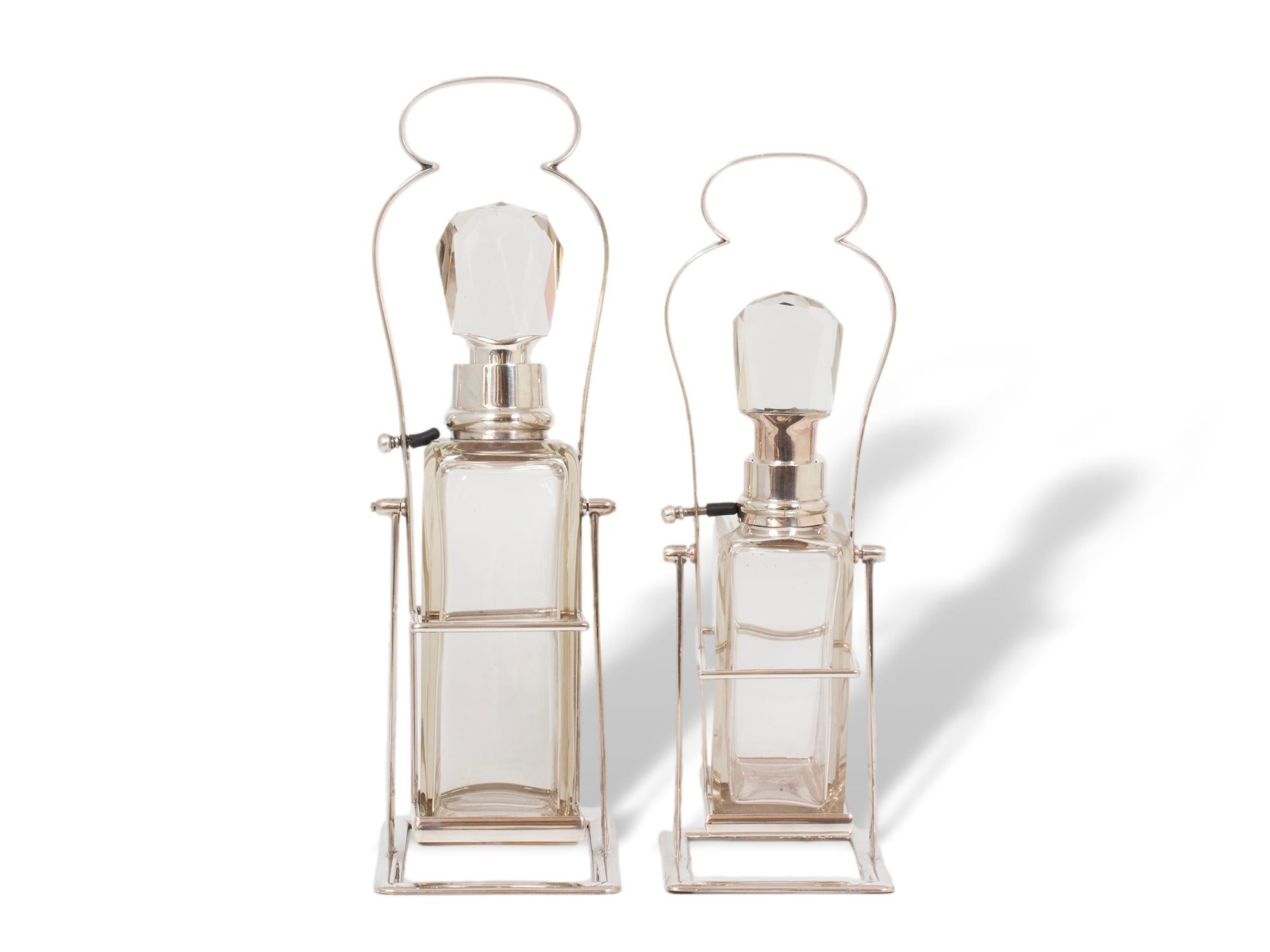 British Hukin & Heath Pair of Silver Tilting Liquor Decanters For Sale