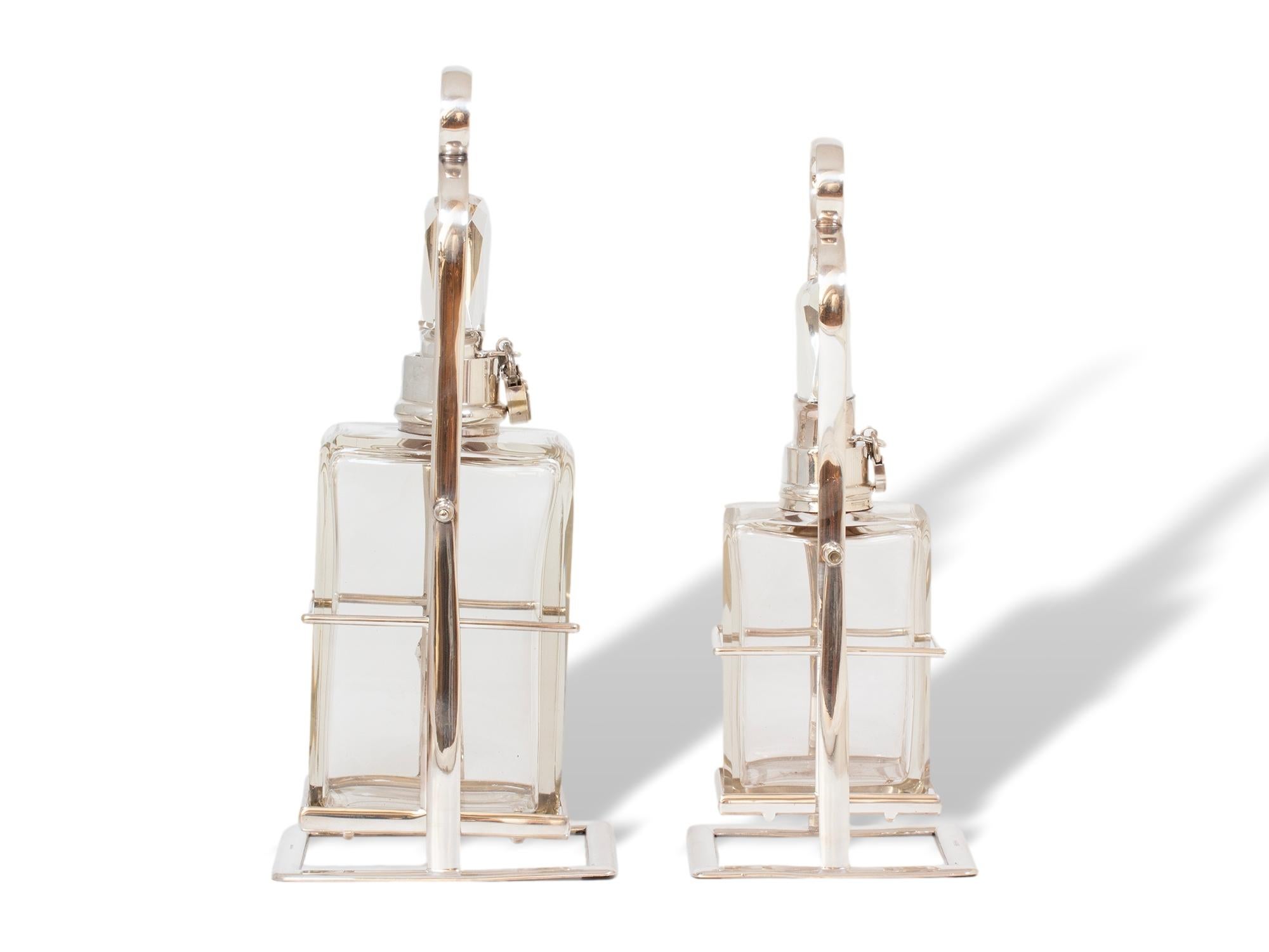 Cast Hukin & Heath Pair of Silver Tilting Liquor Decanters For Sale