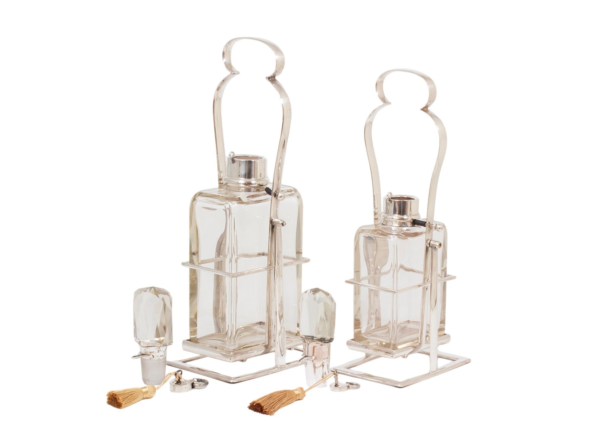 Hukin & Heath Pair of Silver Tilting Liquor Decanters For Sale 1