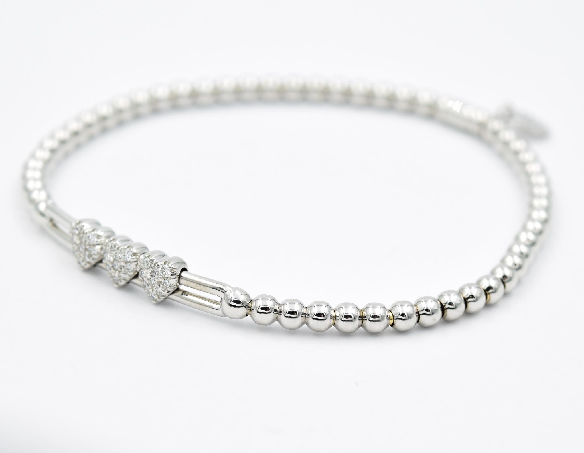 Hulchi Belluni stretchable diamond pavé heart station bracelet from the Tresore Collection in 18k white gold set with high quality white diamonds. Also available in yellow gold. 

0.23ctw of Diamonds 
Beaded & stretchable for extra comfort & style