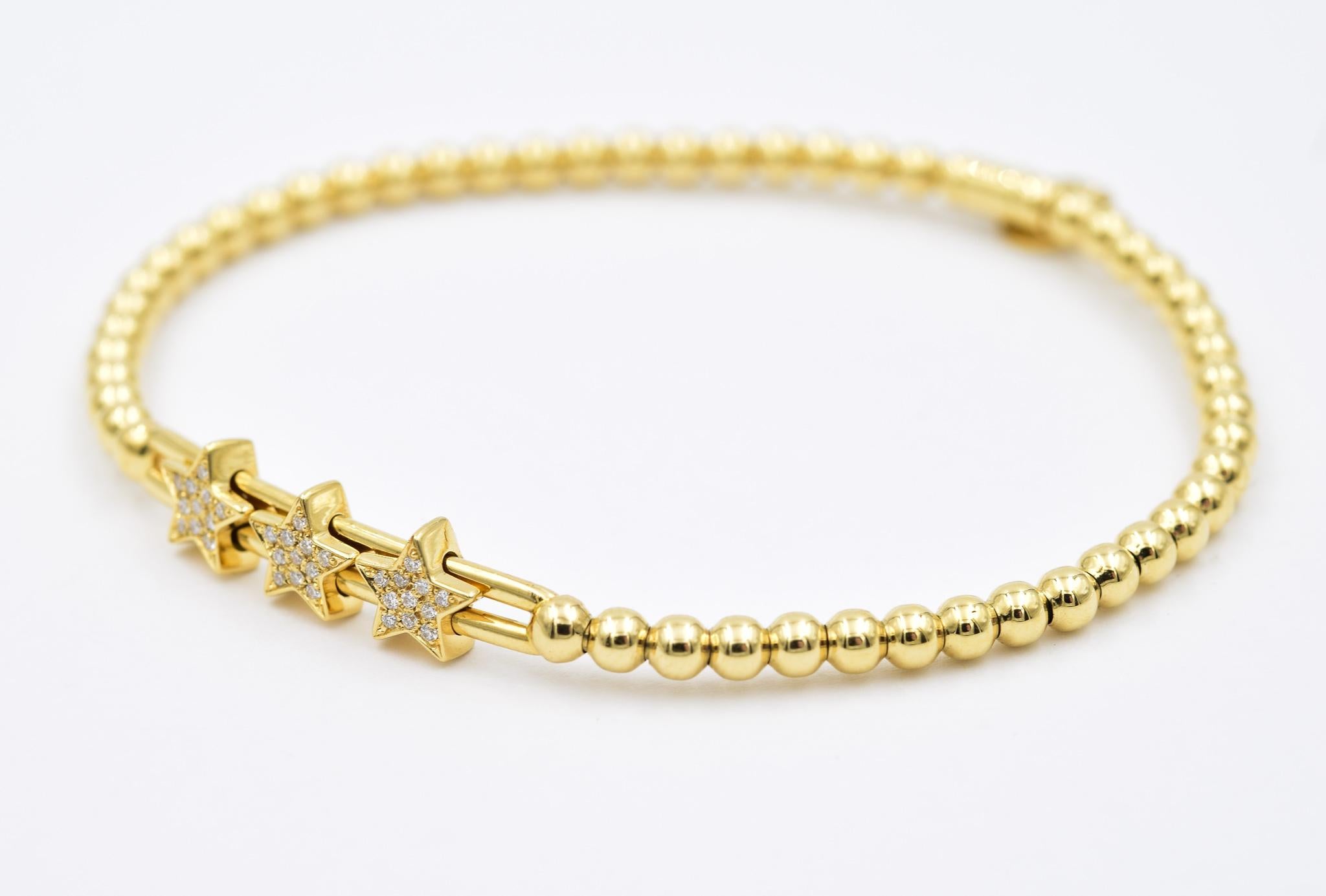 Hulchi Belluni diamond triple star stretchable bracelet from the Tresore Collection in 18k yellow gold set with high quality white diamonds. Also available in White Gold.

0.10ctw of Diamonds 
Beaded & stretchable for extra comfort & style