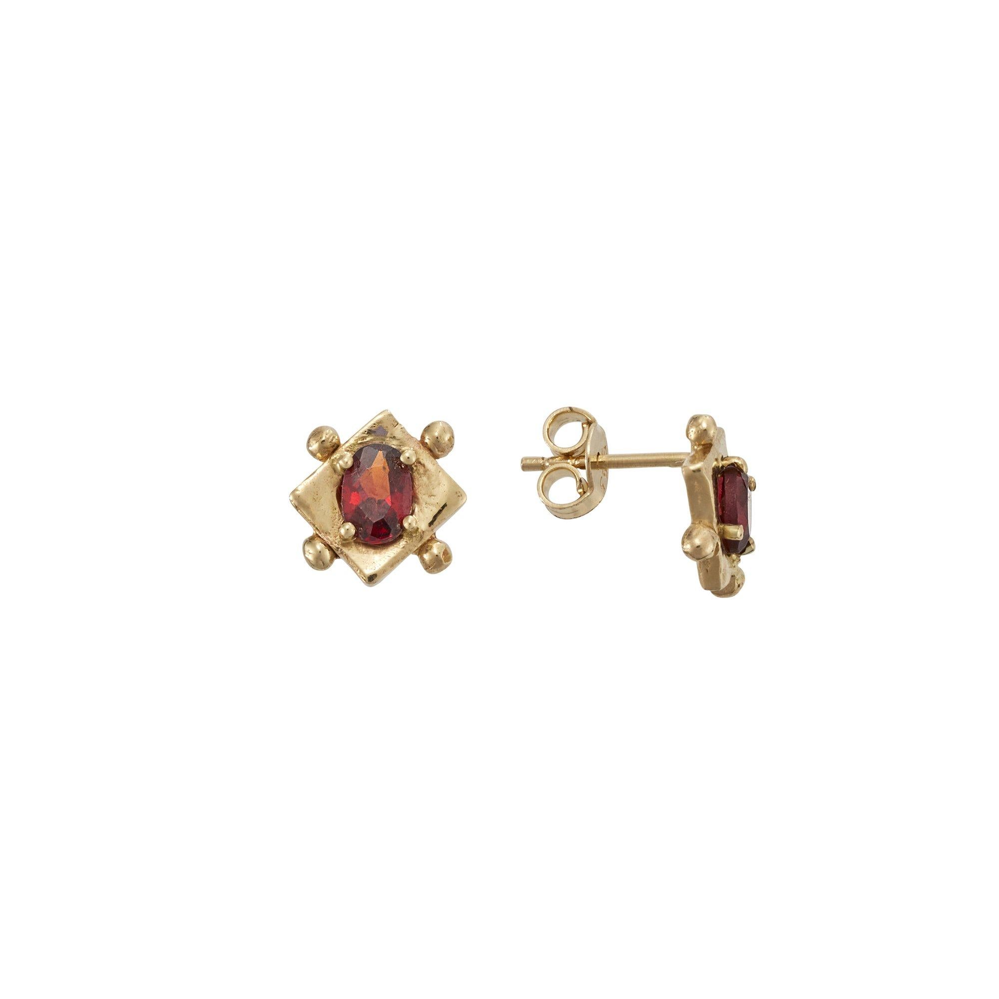 Hulm Studs, 14 Karat Yellow Gold with Garnet
Handcrafted and individually cast in solid gold. Olivia carves each piece from wax, making these items unique, which we believe is what gives them their beauty. The Hulm studs are 14K solid gold set with