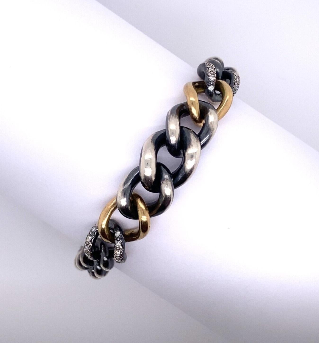 Hum Armband aus 18 Karat Gelbgold und Silber, gefasst mit 0,20 Karat Diamanten (Moderne)