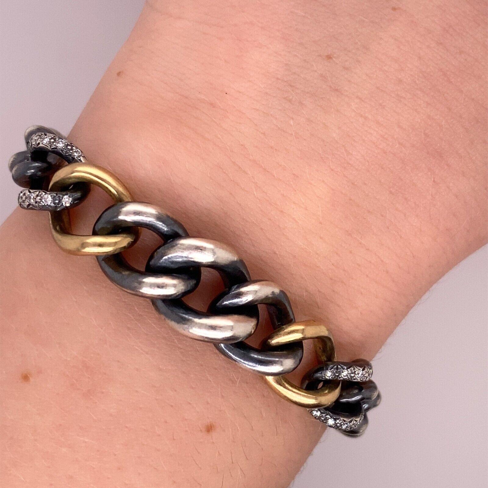 Hum Armband aus 18 Karat Gelbgold und Silber, gefasst mit 0,20 Karat Diamanten (Rundschliff)