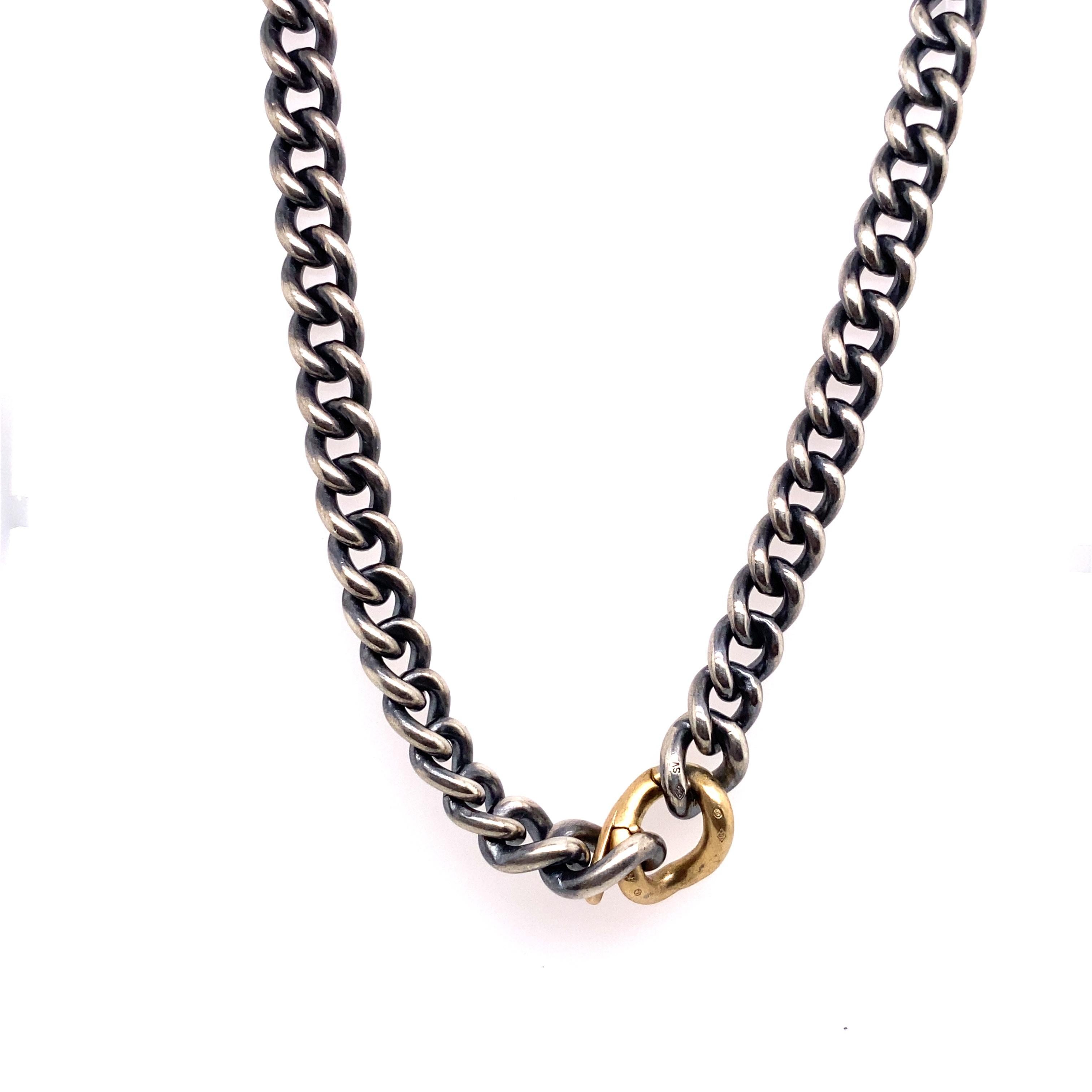 A quality piece of jewellery, this HUM curb chain necklace is an elegant and stylish addition to any outfit. 
It features an 18ct gold and silver curb chain design.
Total Weight: 82.3g
Width of Chain: 8mm
Necklace Length: 18