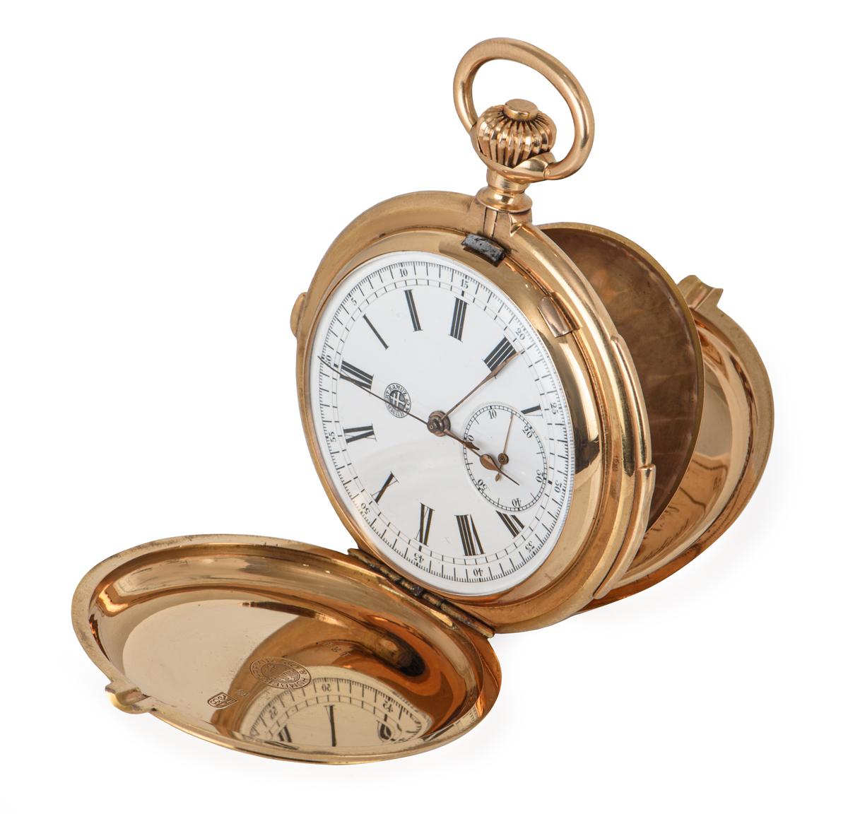 An antique NOS full hunter 60mm minute repeater chronograph pocket watch in 18k rose gold, by Humbert Ramuz & Co. Features a white enamel dial with Roman numerals and a small seconds display. Fitted with plastic glass and a manual wind