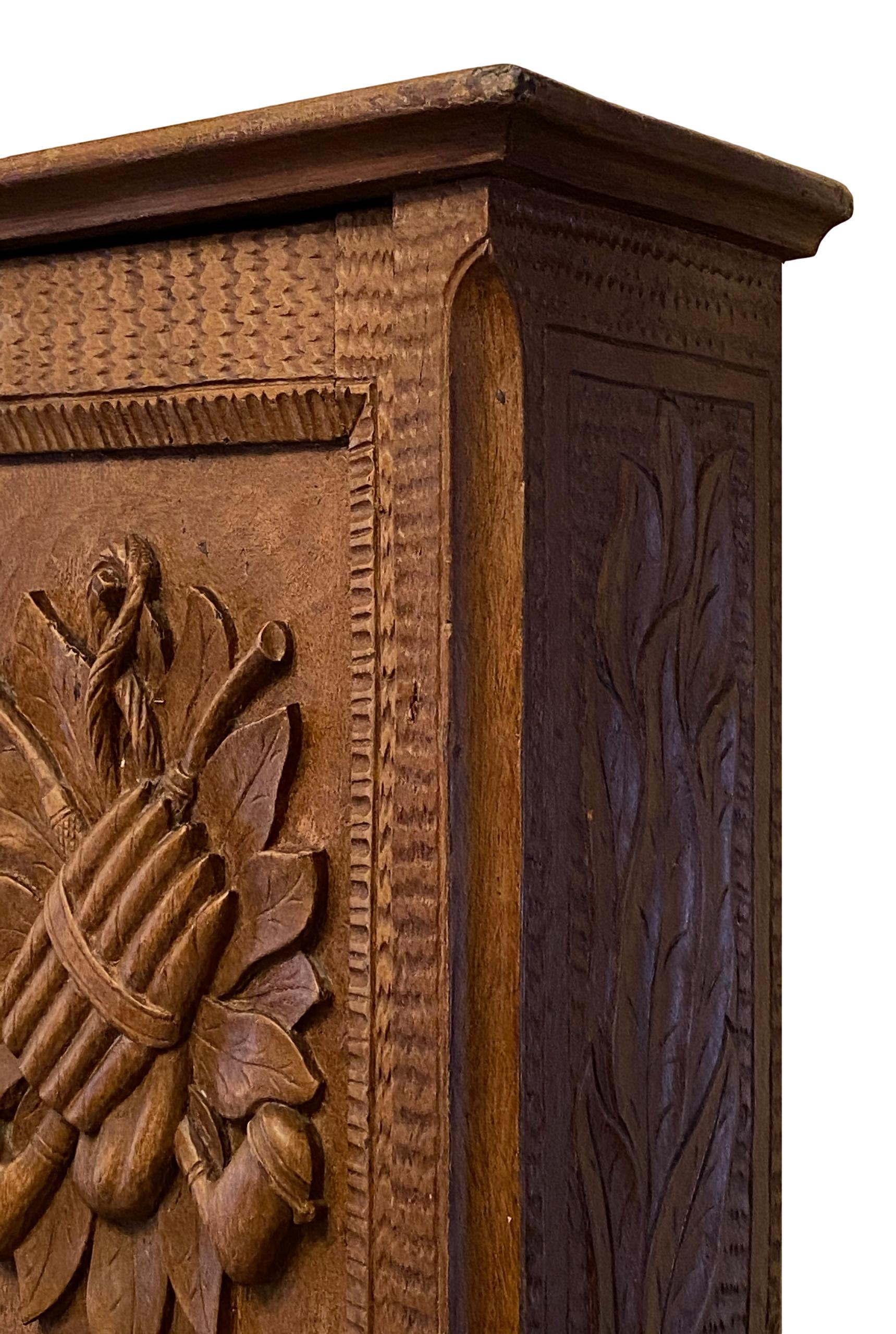 Stunning Black Forest Brienz wood carved wall cabinet. Made in Germany in the 1880s or older. Some color spots, also some old repairs to the wood and a new lock, but this is old-age. Door closes a little strong, but this is also old-age. It has a
