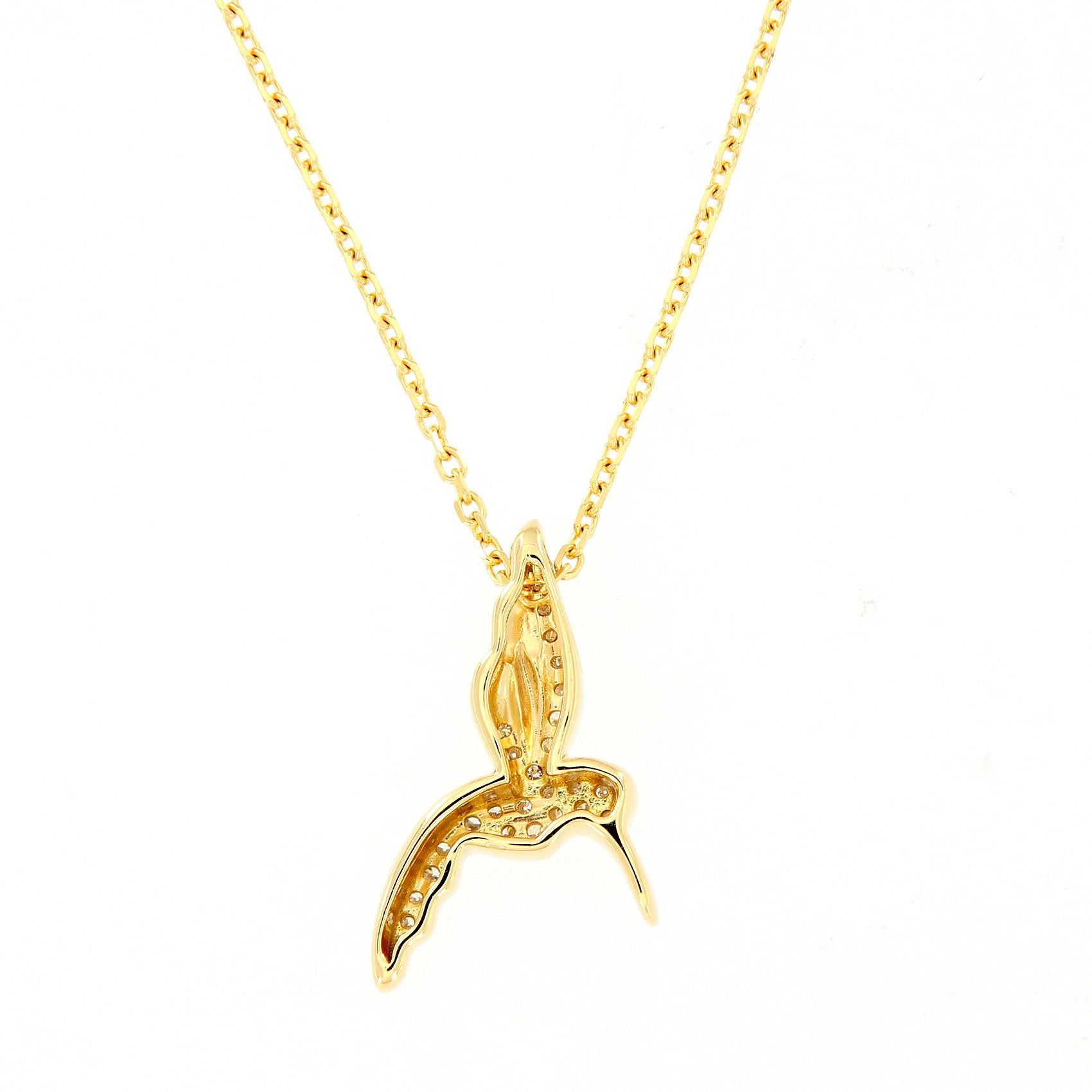 Sweet hummingbird pendant necklace crafted in 18k yellow gold with pave diamonds. The pendant is 18 mm long and hangs from a 16 inch to 18 inch chain. Weighs 3.1 grams.

Diamonds .08 cttw