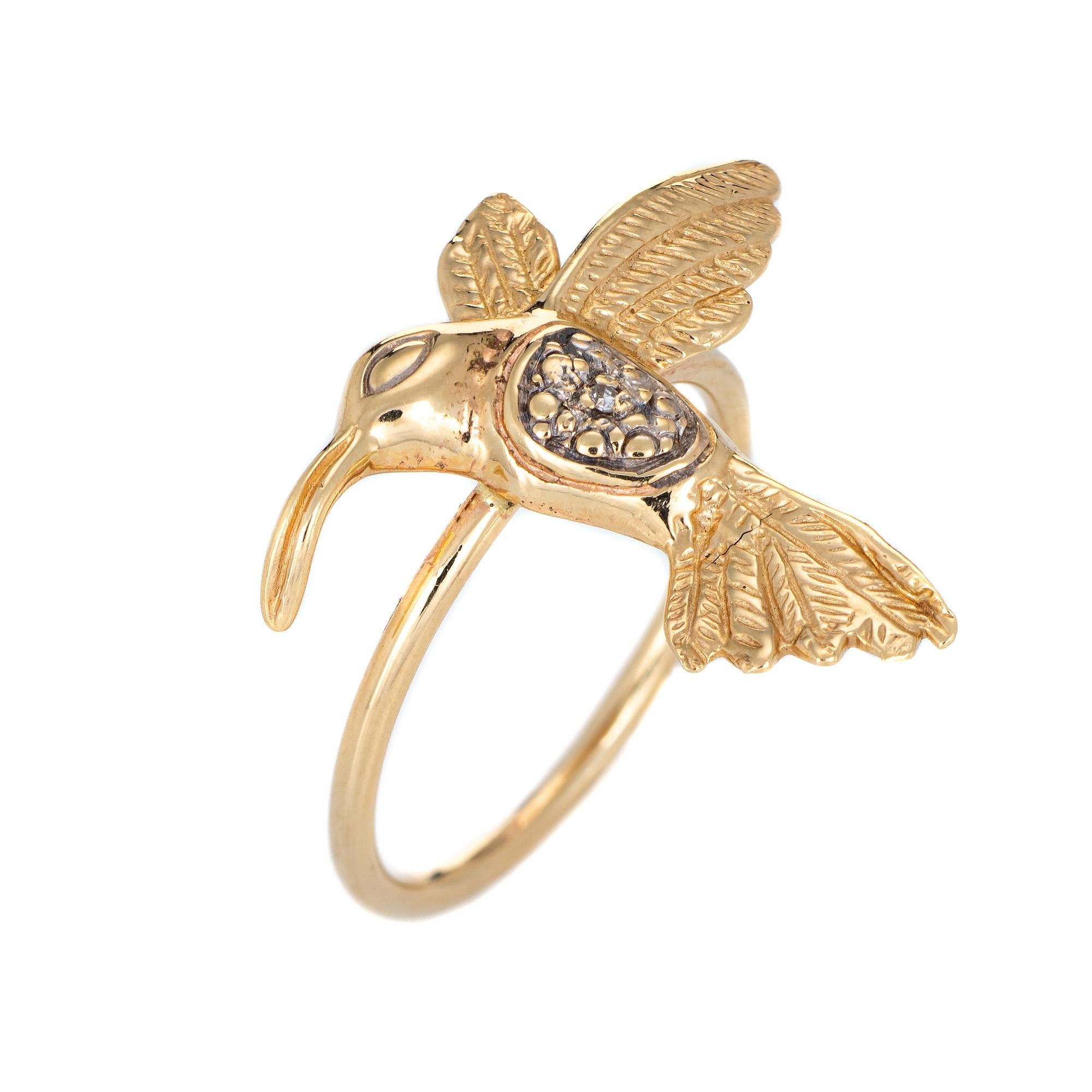 Originally a vintage stick pin the hummingbird ring is crafted in 14 karat yellow gold.

The ring is mounted with the original stick pin. Our jeweler rounded the stick pin into a slim band for the finger. The charming ring features lifelike detail