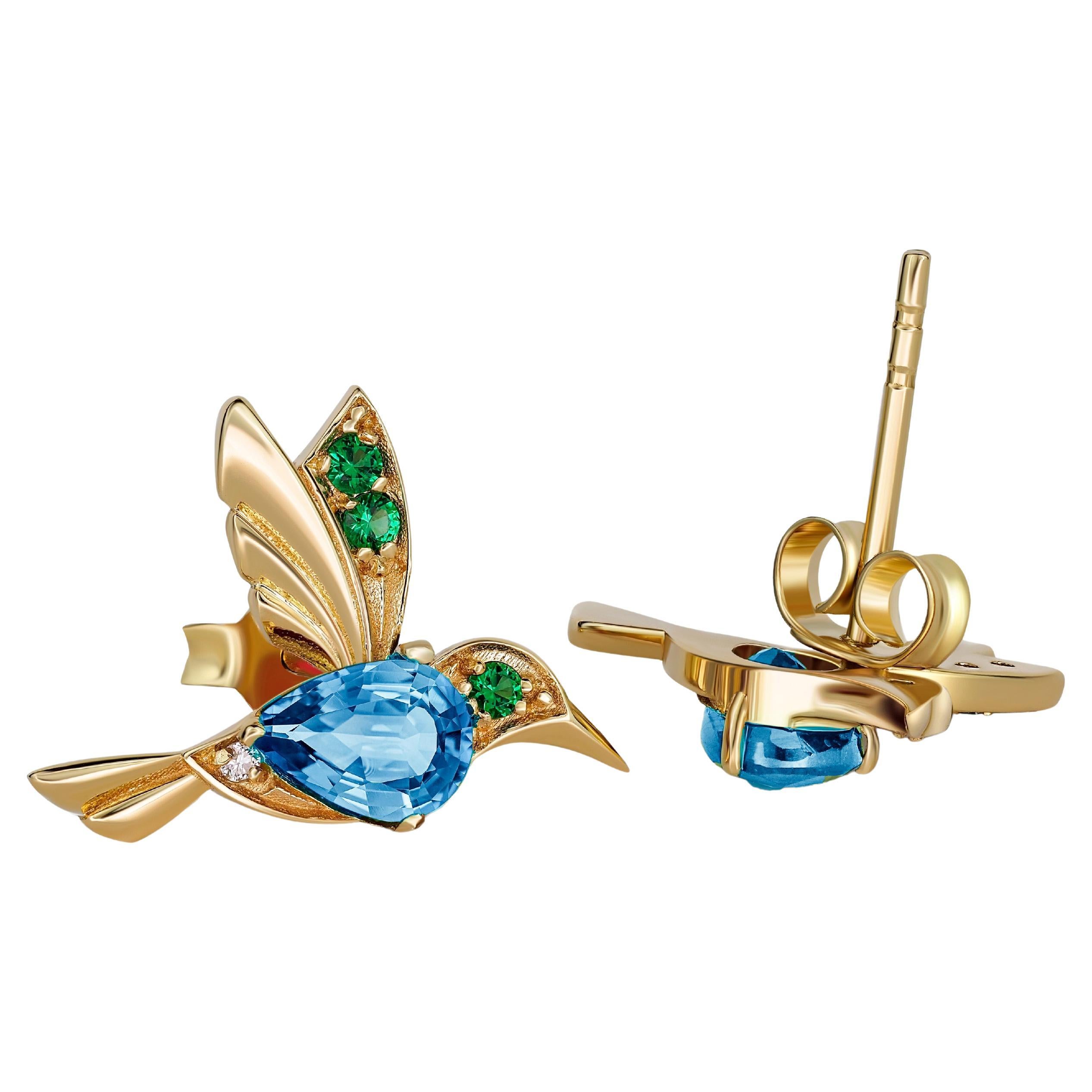 Orecchini con colibrì e topazi blu in oro 14k