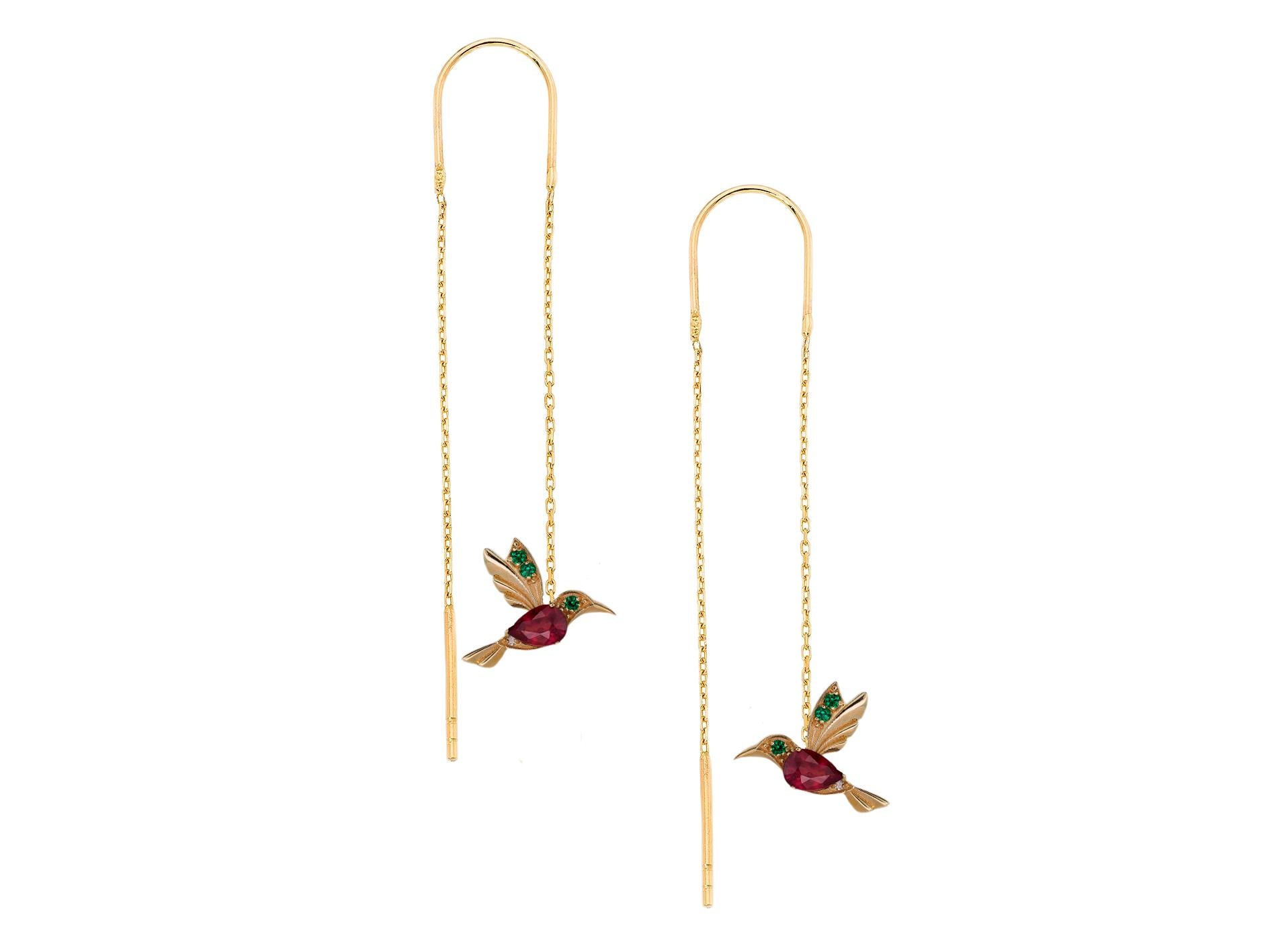 Hummingbird Threader earrings with rubies in 14k gold. 

Bird Earrings with gems. Ruby july birthstone earrings. Pear ruby earrings.

Metal: 14 karat gold
Weight: 2.95 g.
Size:  44mm - chain length,  11.73 x 15.85 mm. - pendant size.

Central