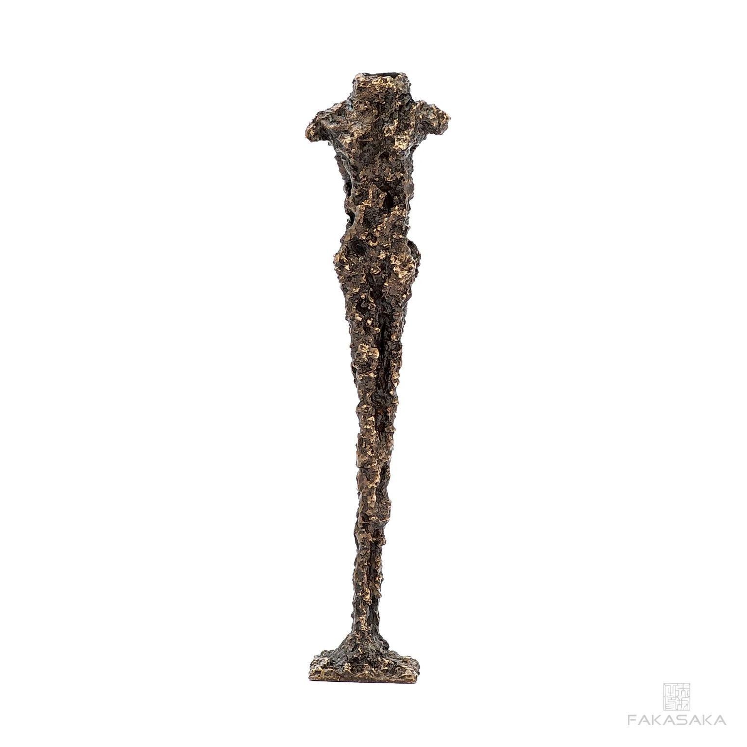 Hun Candleholder by Fakasaka Design
Dimensions: W 9 cm D 6 cm H 33 cm.
Materials: dark bronze.
Also available in polished bronze.

 FAKASAKA is a design company focused on production of high-end furniture, lighting, decorative objects, jewels, and